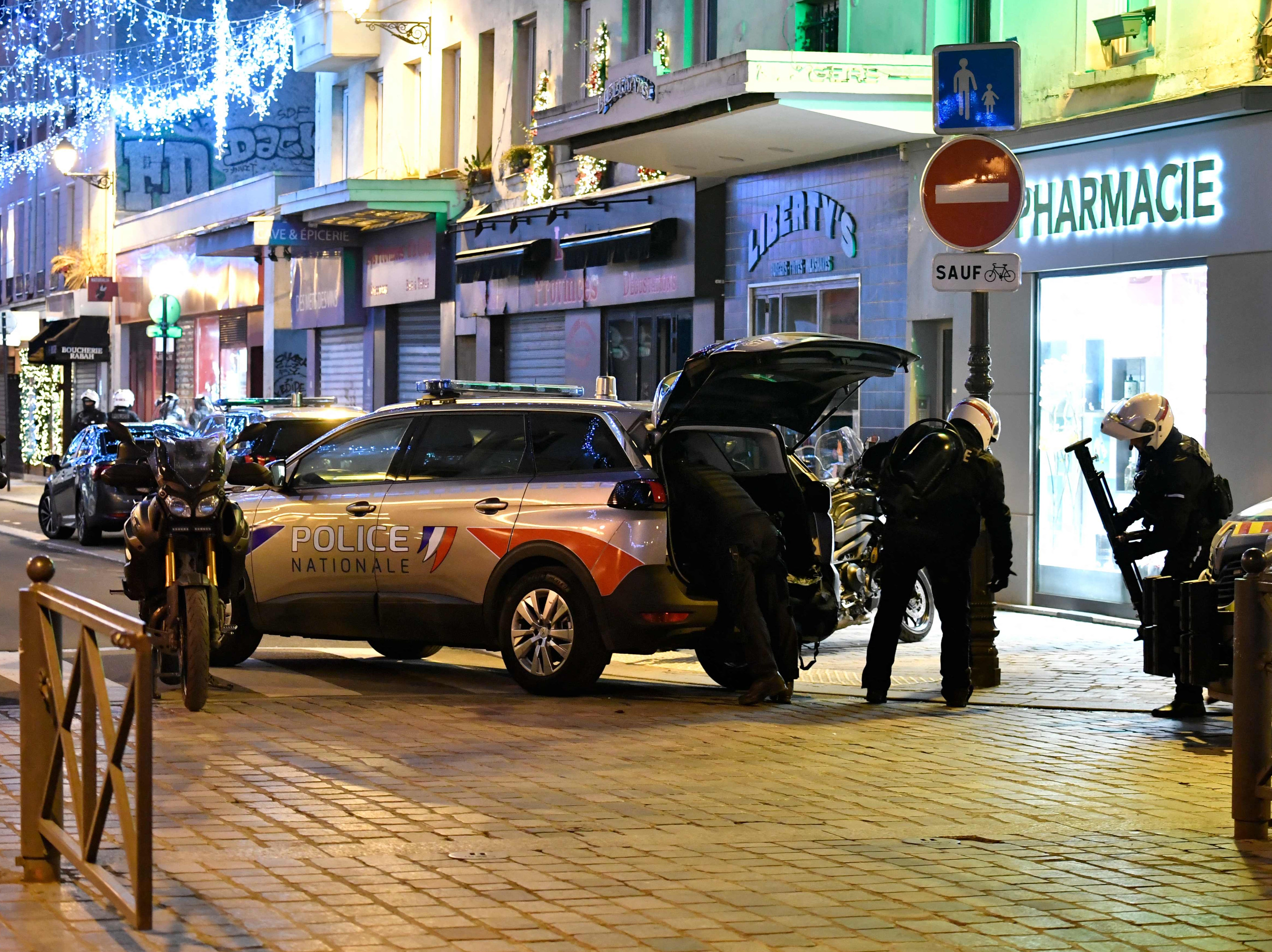 Police respond to an incident in Paris where a man armed with a knife took two women hostage