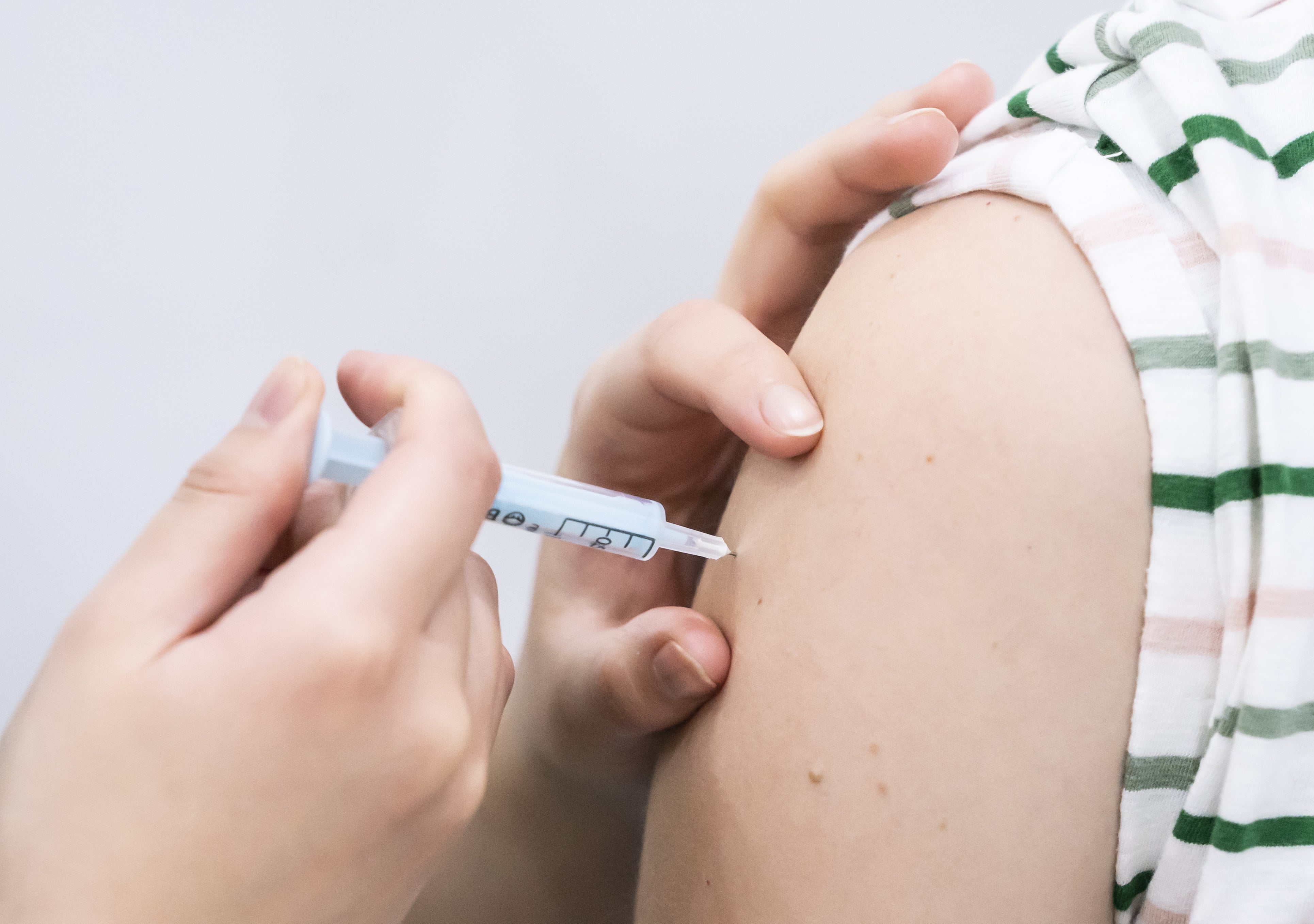 A booster coronavirus vaccine is administered (Danny Lawson/PA)