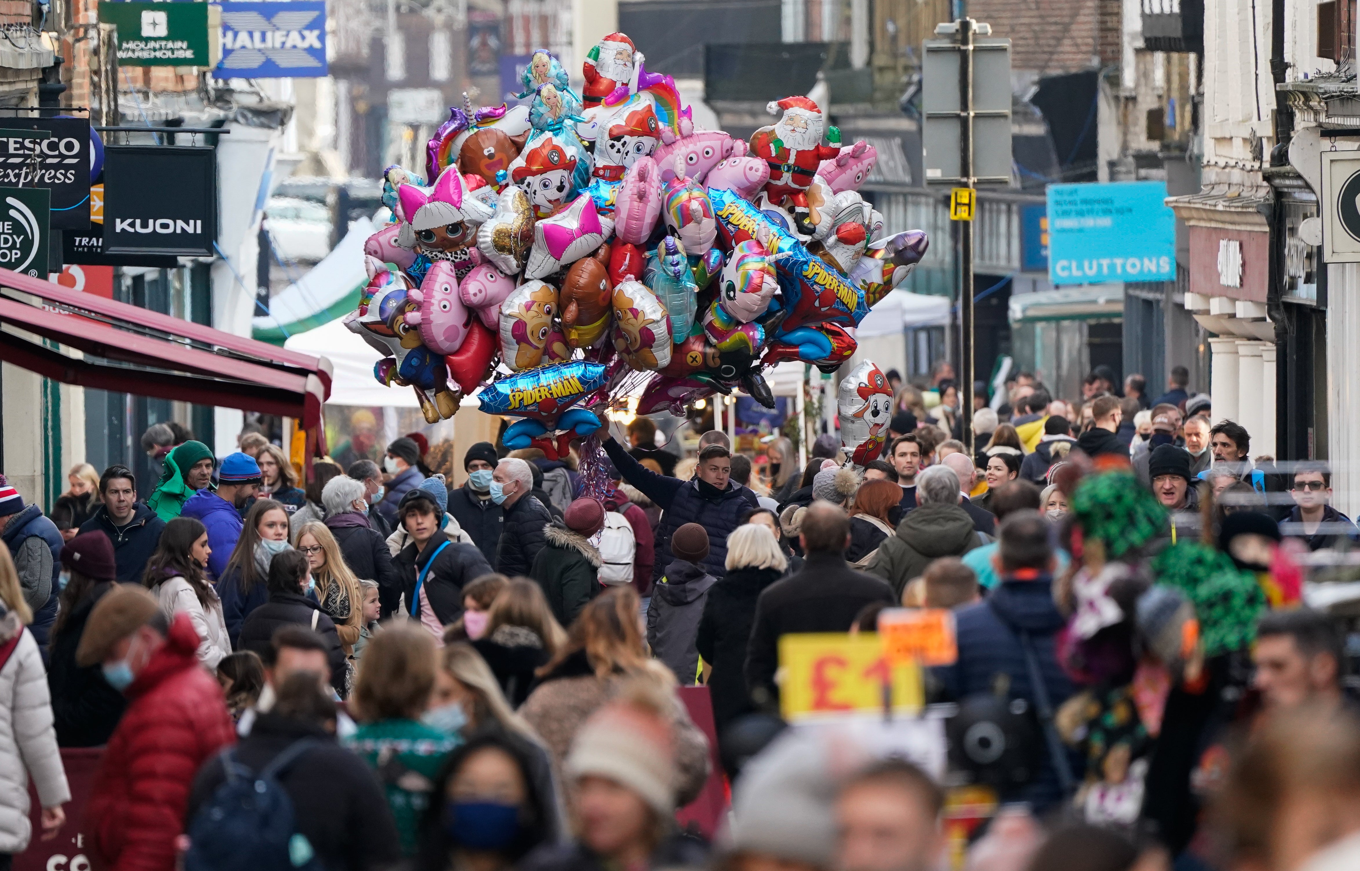 Christmas shoppers make their way along the High Street in Winchester (Andrew Matthews/PA)