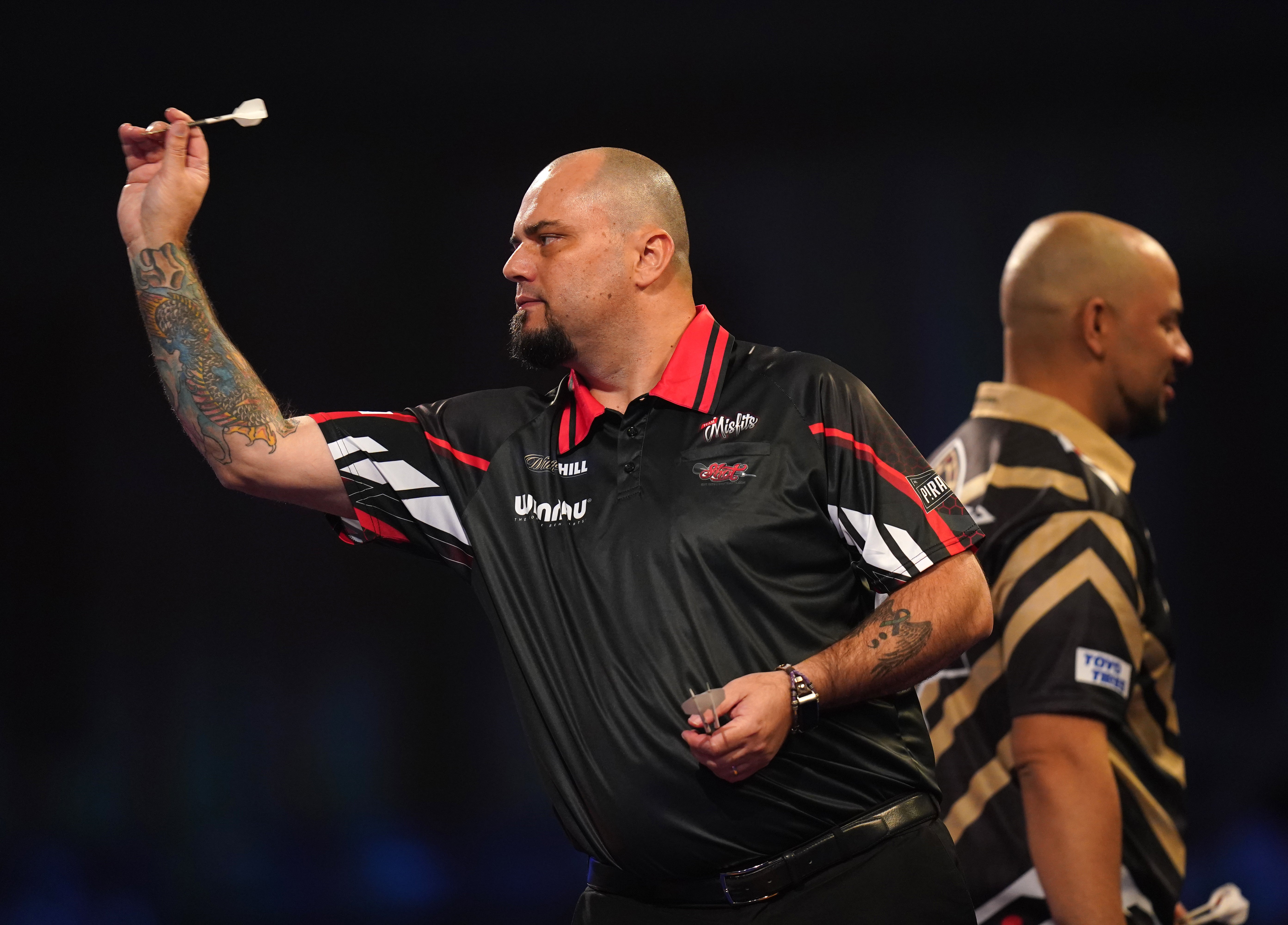 Australian qualifier Raymond Smith (left) continued his impressive run at Alexandra Palace (Adam Davy/PA)