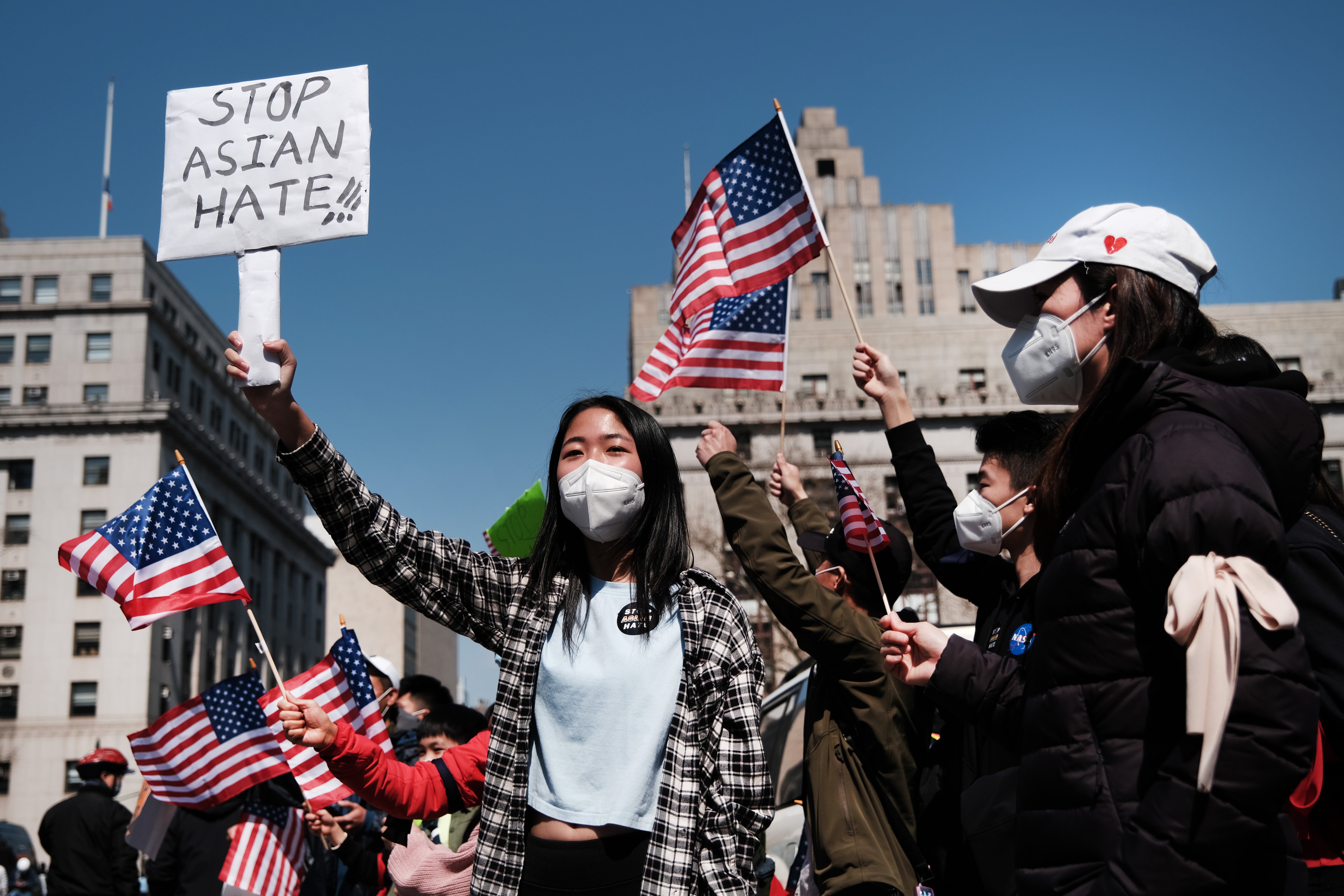 People participate in a protest to demand an end to anti-Asian violence on April 04, 2021