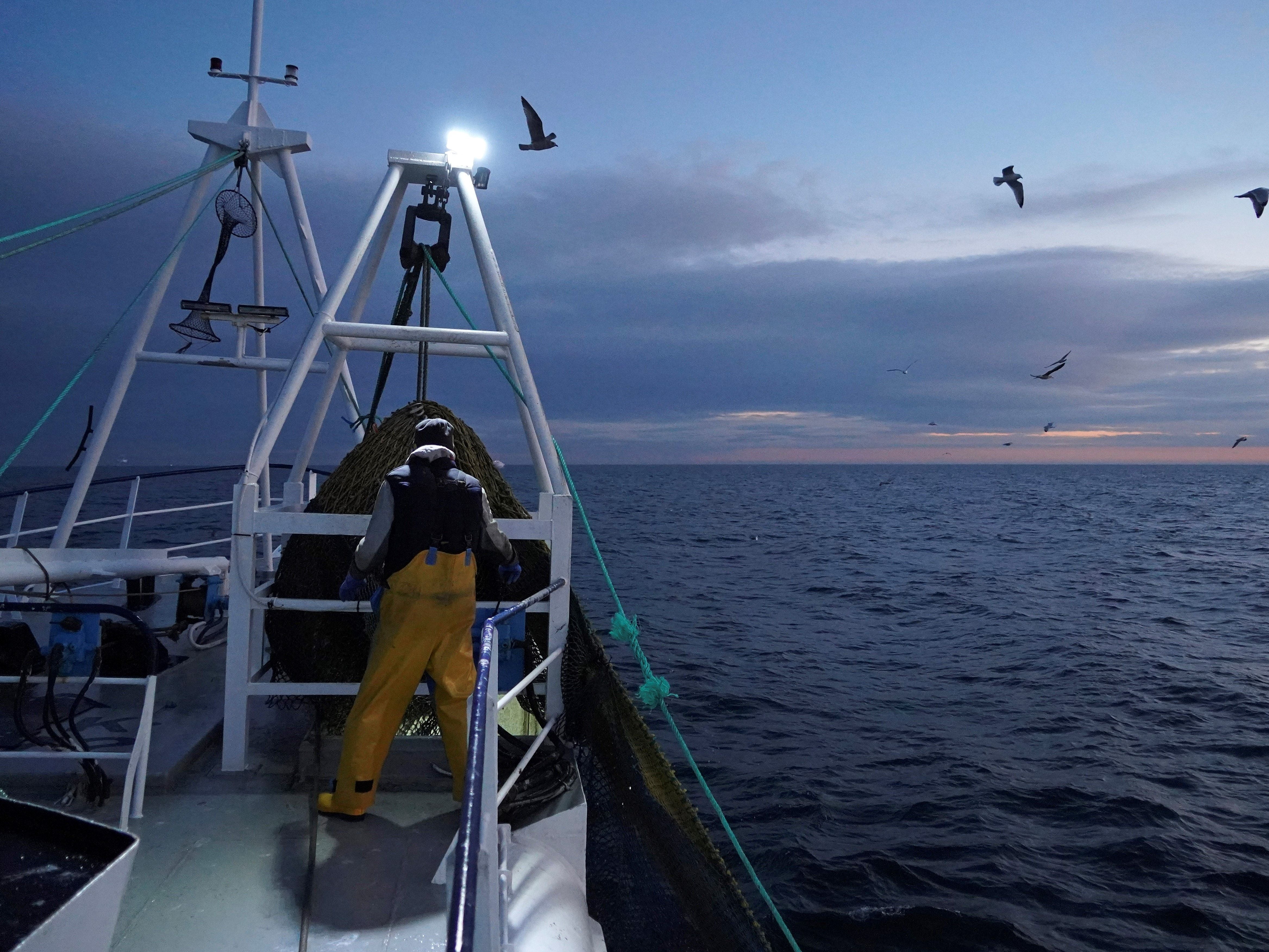 Fishermen work aboard a trawler in the North Sea, off the coast of North Shields