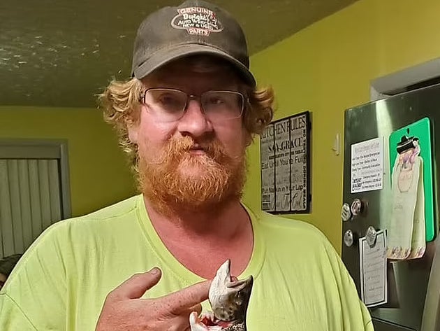 Brent Brown holds a fish in image posted to his Facebook page
