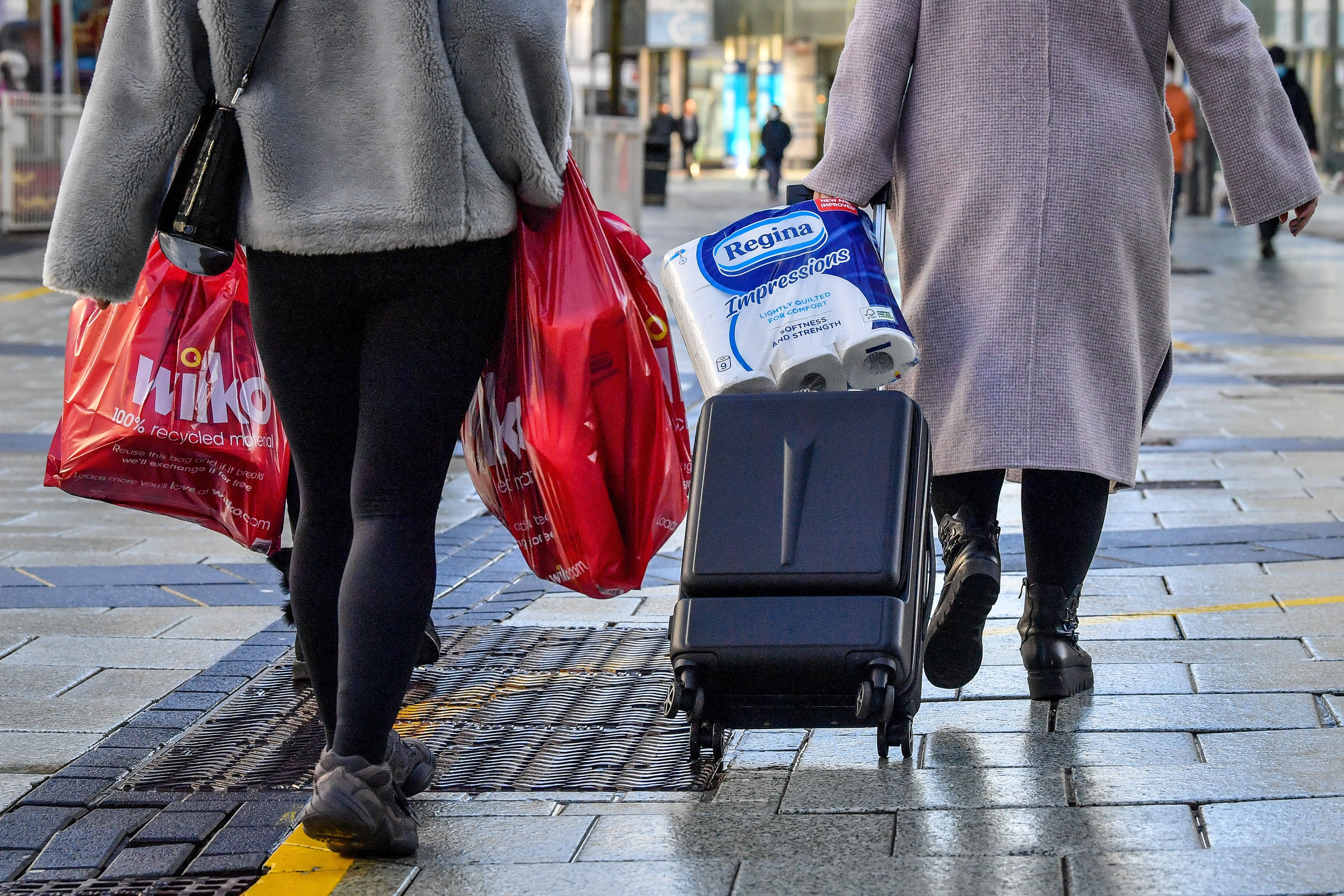 Shoppers in Cardiff city centre (PA)