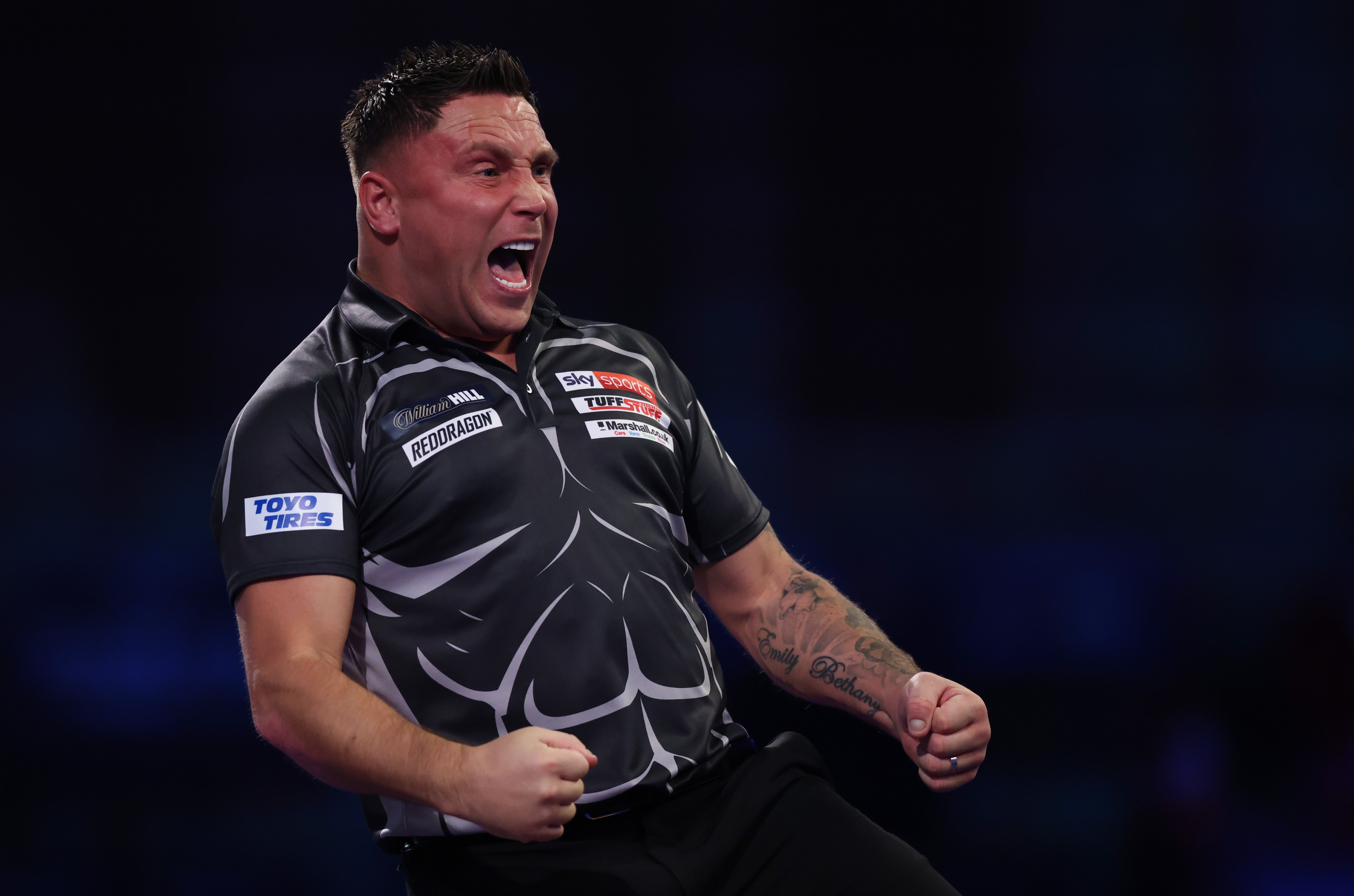 Defending world champion Gerwyn Price celebrates during his second round match against Ritchie Edhouse