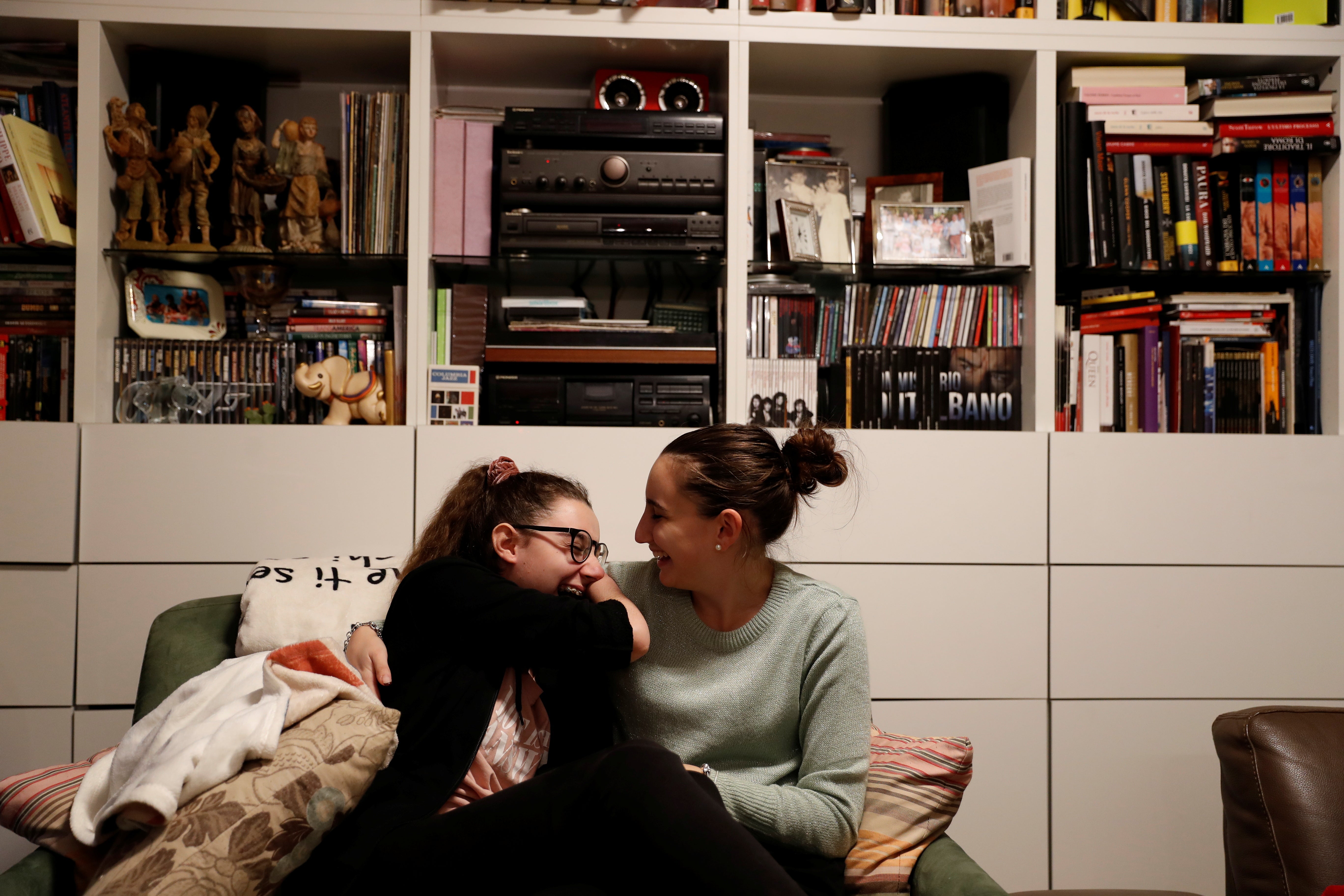 Francesca jokes with her sister Sara at their father’s house in Magione