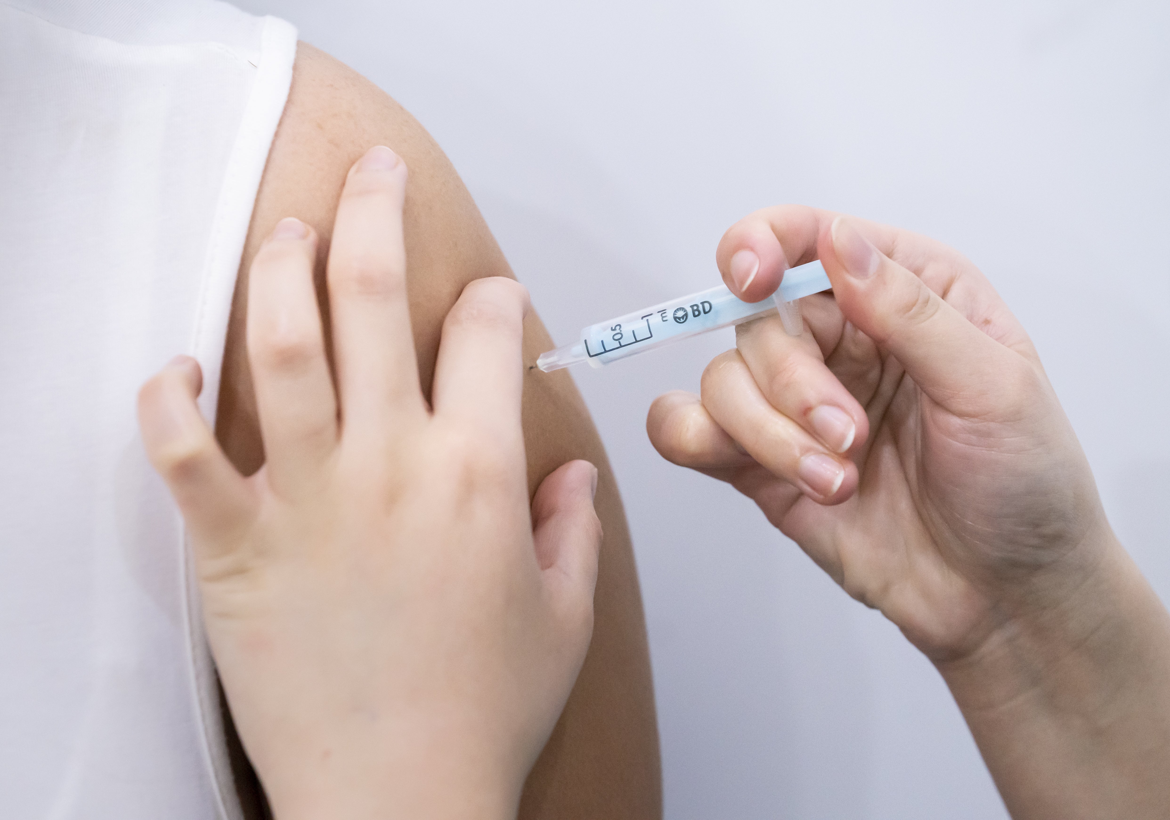 A booster coronavirus vaccine is administered at a Covid vaccination centre at Elland Road in Leeds, as the booster vaccination programme continues across the UK (Danny Lawson/PA)