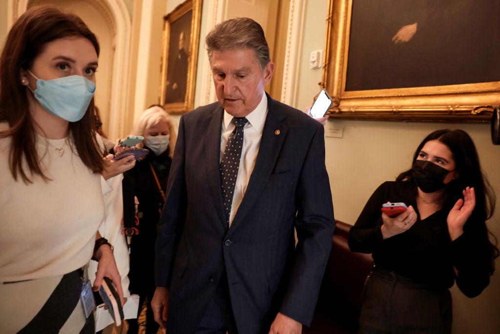 Sen Joe Manchin speaks to reporters in the Capitol