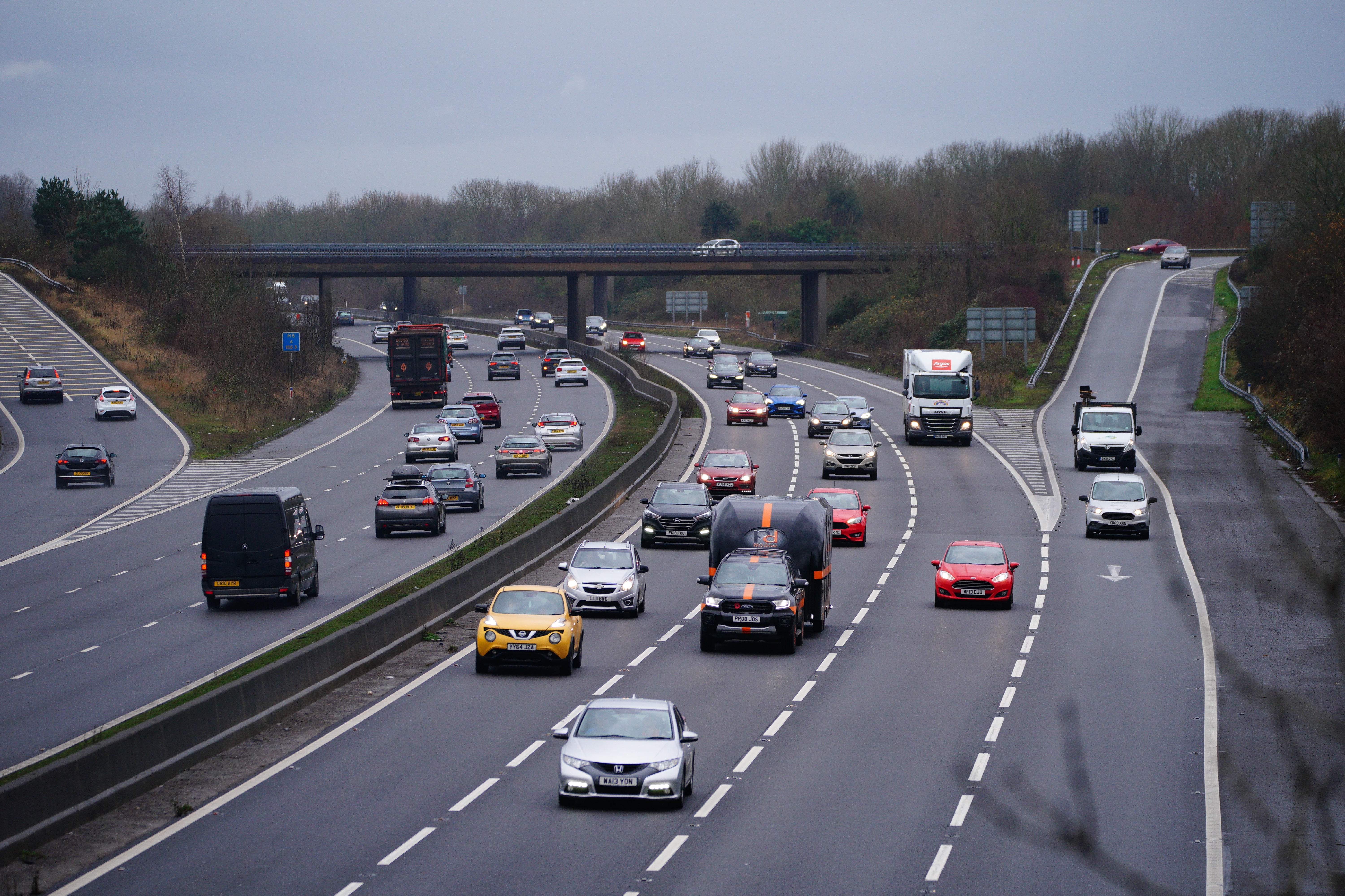 Millions of people are embarking on a last-gasp getaway to spend Christmas with friends and relatives (Ben Birchall/PA)