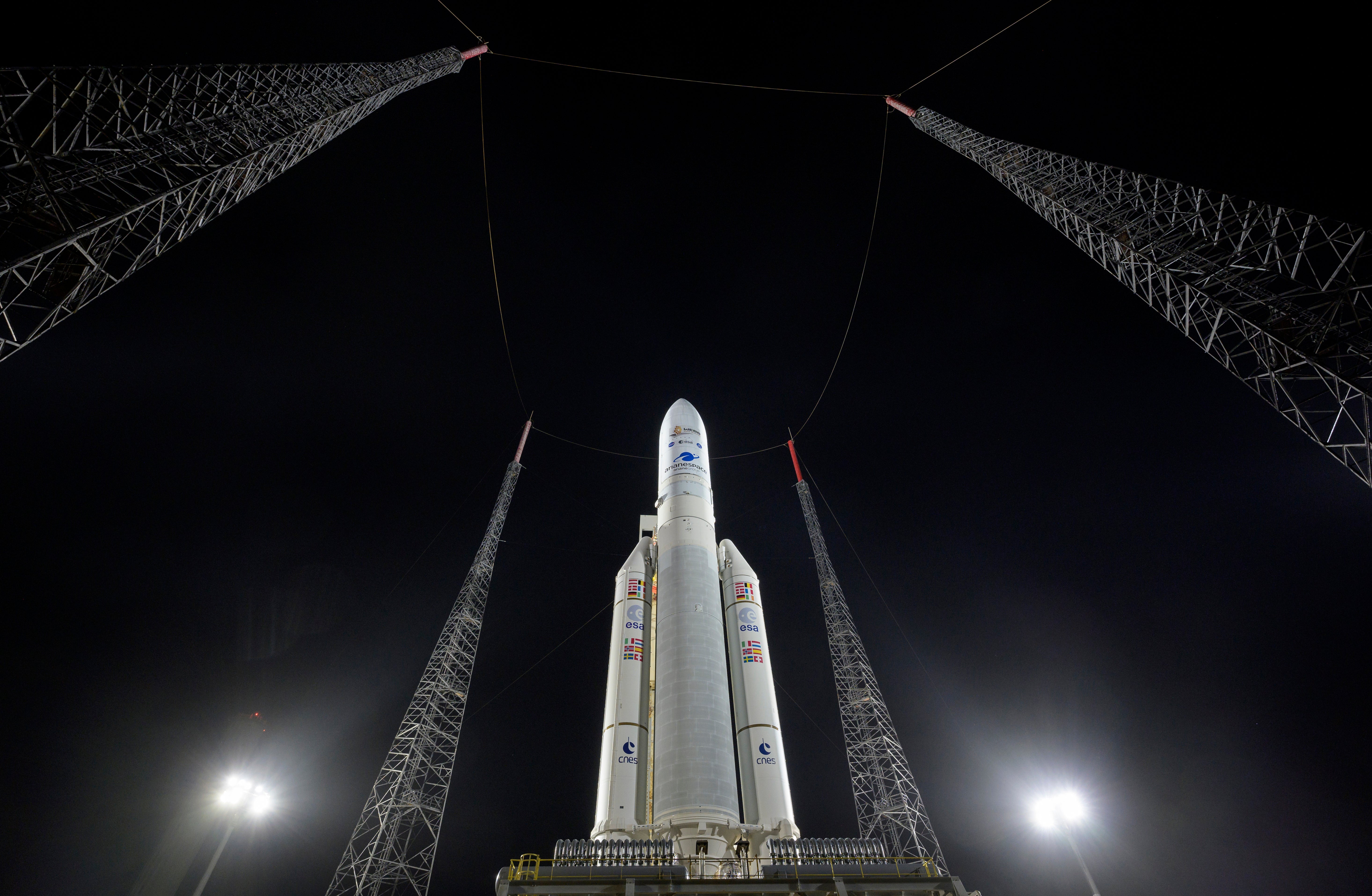 In this photo provided by NASA, Arianespace’s Ariane 5 rocket with NASA’s James Webb Space Telescope onboard, is seen at the launch pad, Thursday, Dec. 23, 2021, at Europe’s Spaceport, the Guiana Space Center in Kourou, French Guiana. The James Webb Space Telescope has infrared vision, allowing it to peer deeper into the universe, all the way to the first stars and galaxies. Liftoff is set for Saturday morning, Dec. 24, on a French rocket from South America. (Bill Ingalls/NASA via AP)