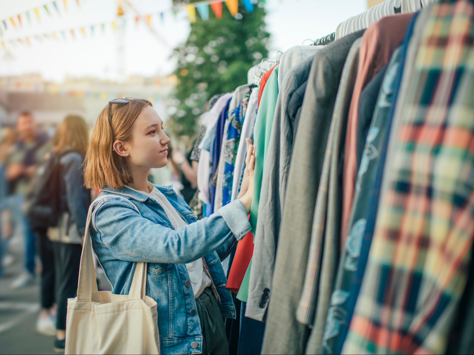 A young woman shops at a second-hand market