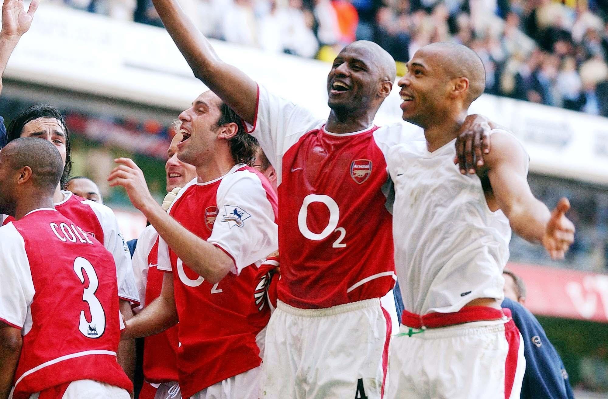 Patrick Vieira (second right) helped Arsenal clinch the title at Tottenham (Sean Dempsey/PA)