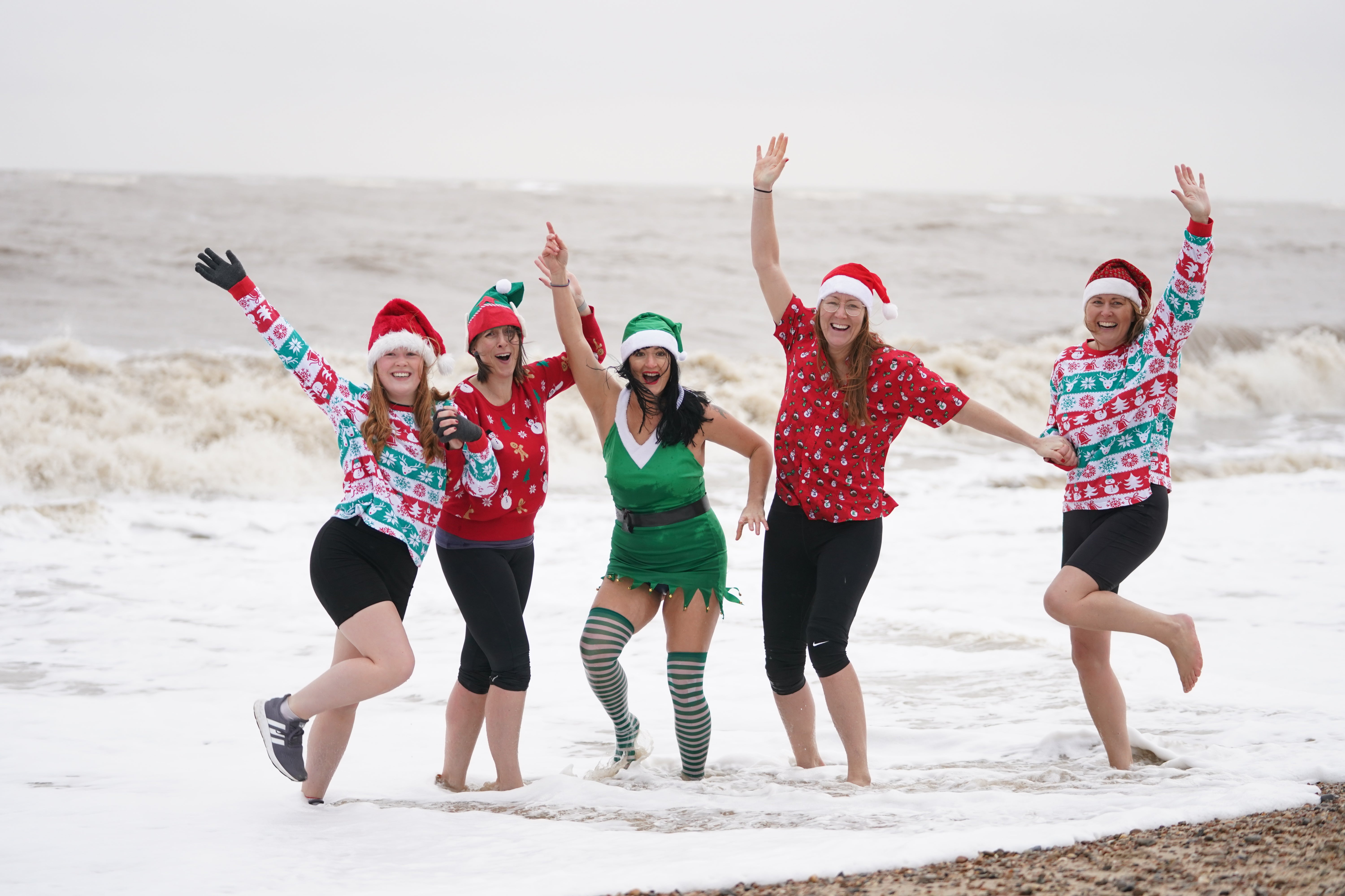 Swimmers pose in the sea at Felixstowe, Suffolk (Joe Giddens/PA)