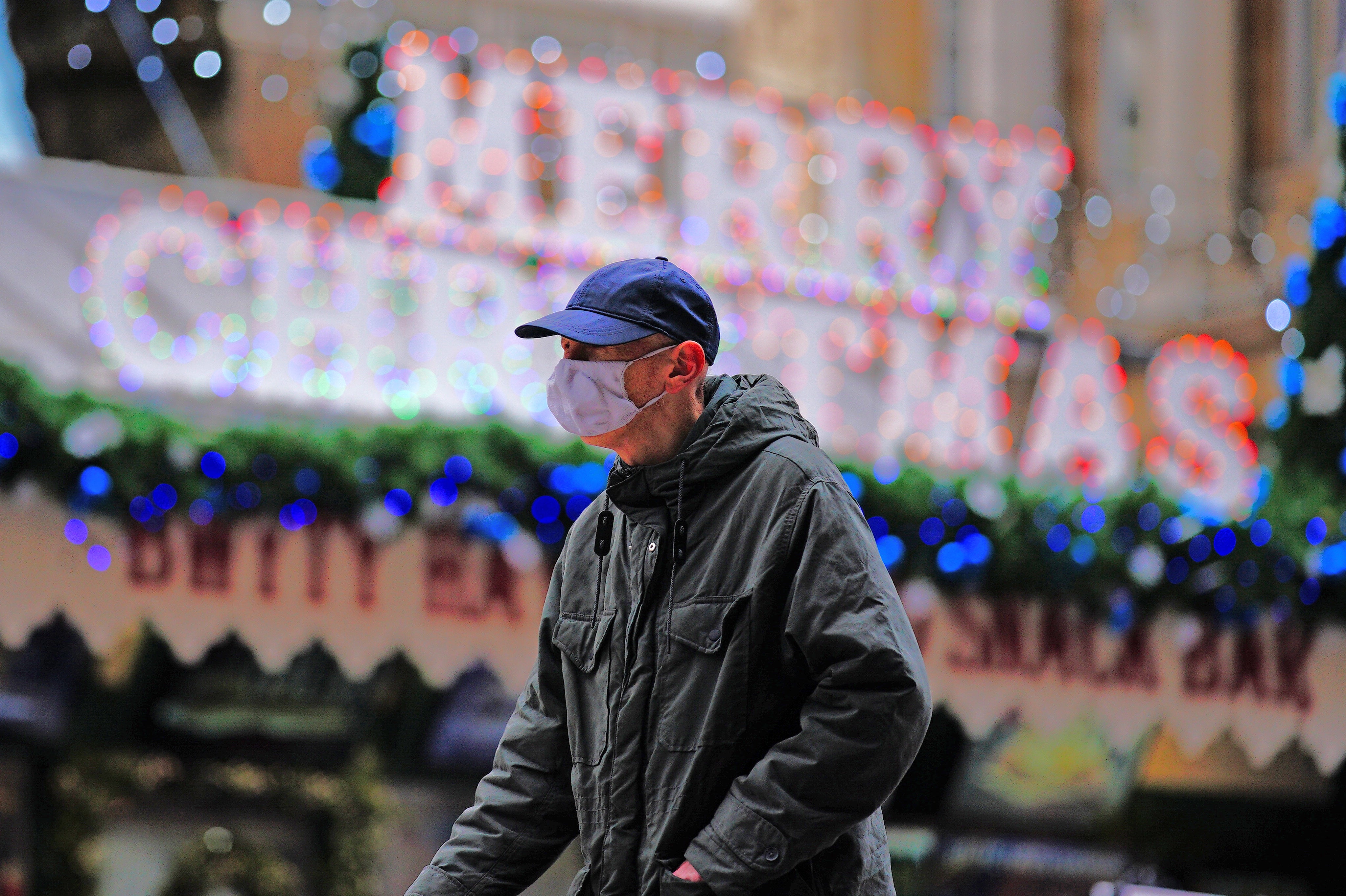 Christmas shoppers walk through the centre of Cardiff, Wales (Ben Birchall/PA)