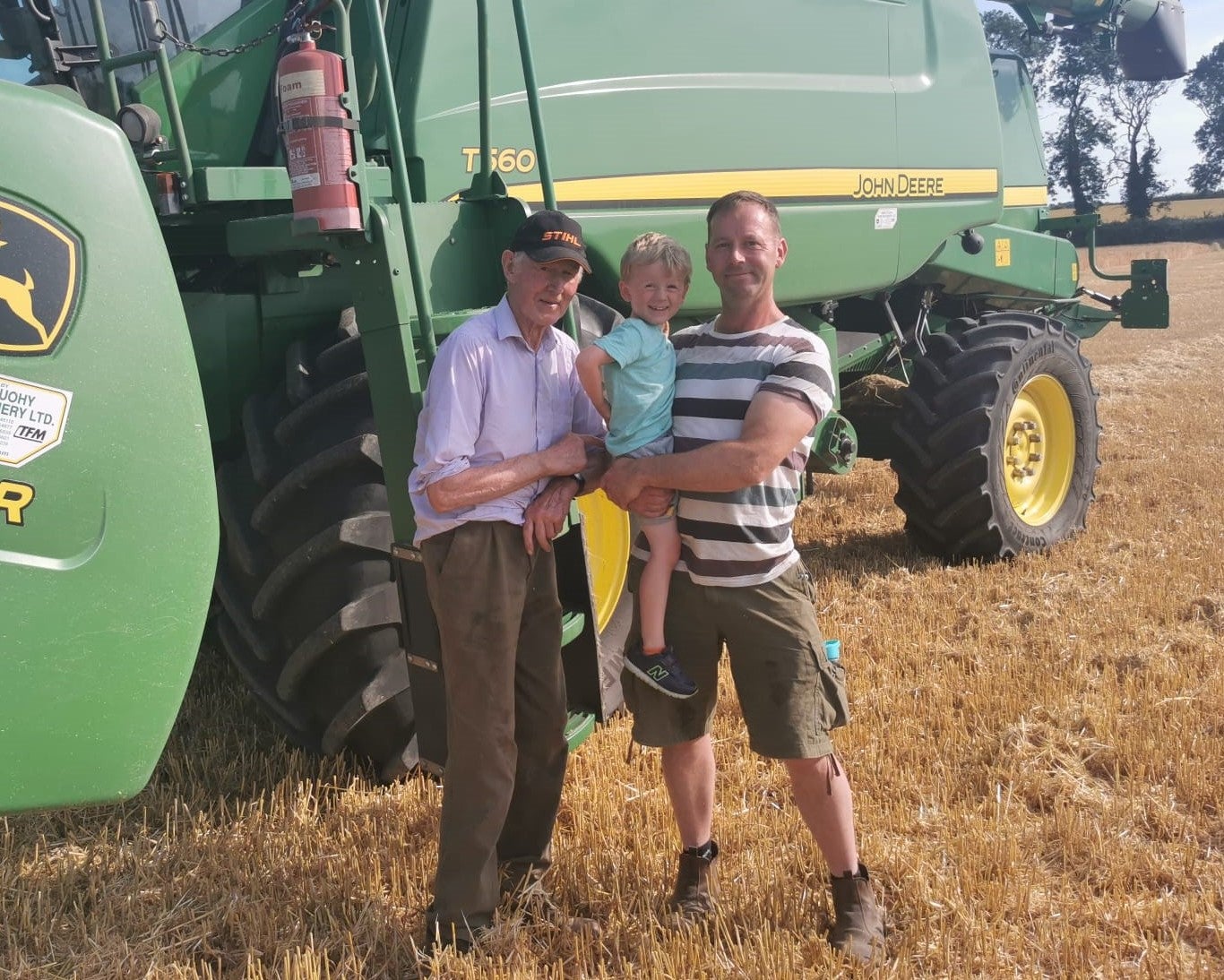 Eugene Ryan, right, with son Eoghan and father Hugh on the family farm in Portlaoise (Eugene Ryan/PA)