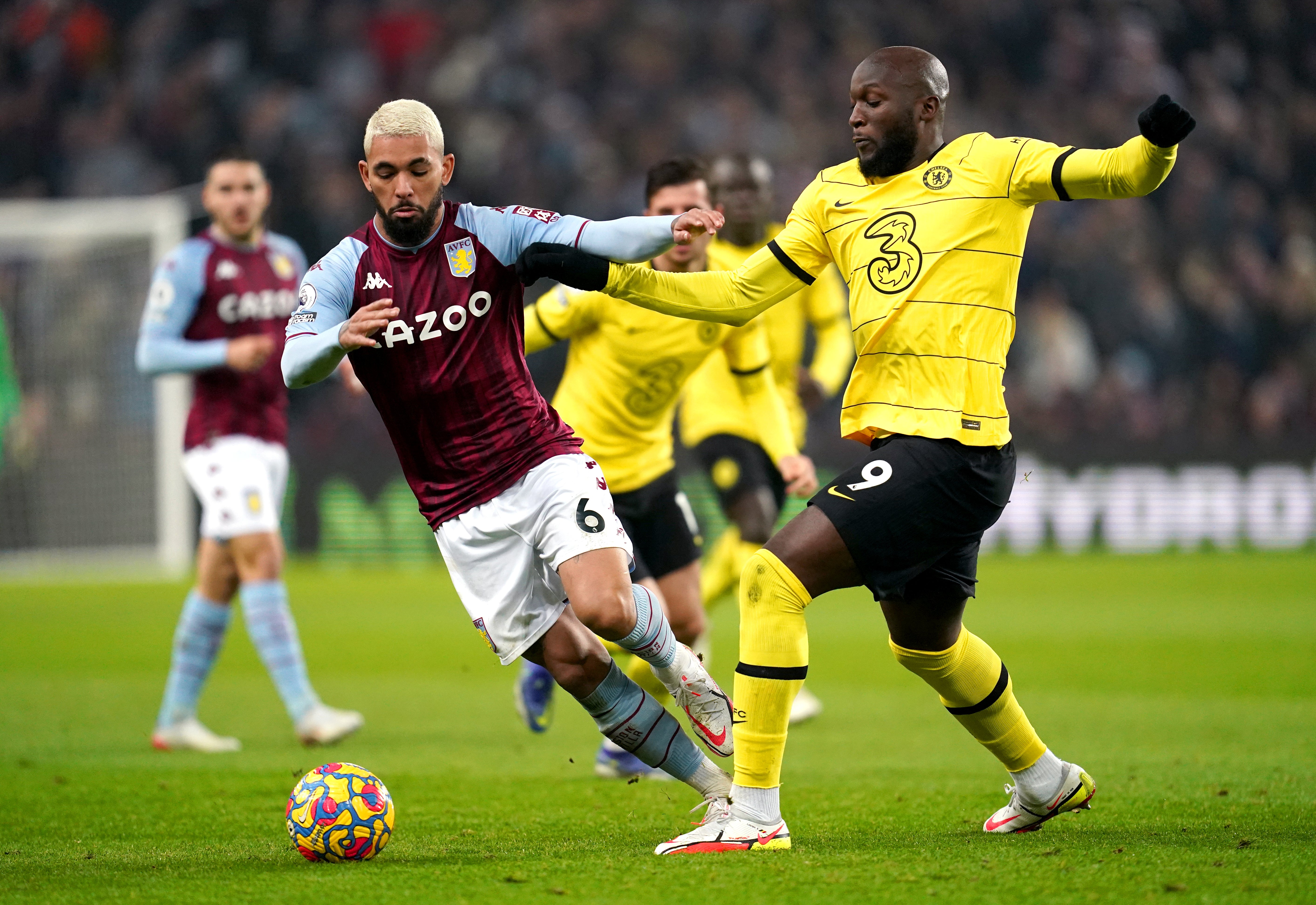 Douglas Luiz, left, battles with Romelu Lukaku (Nick Potts/PA)