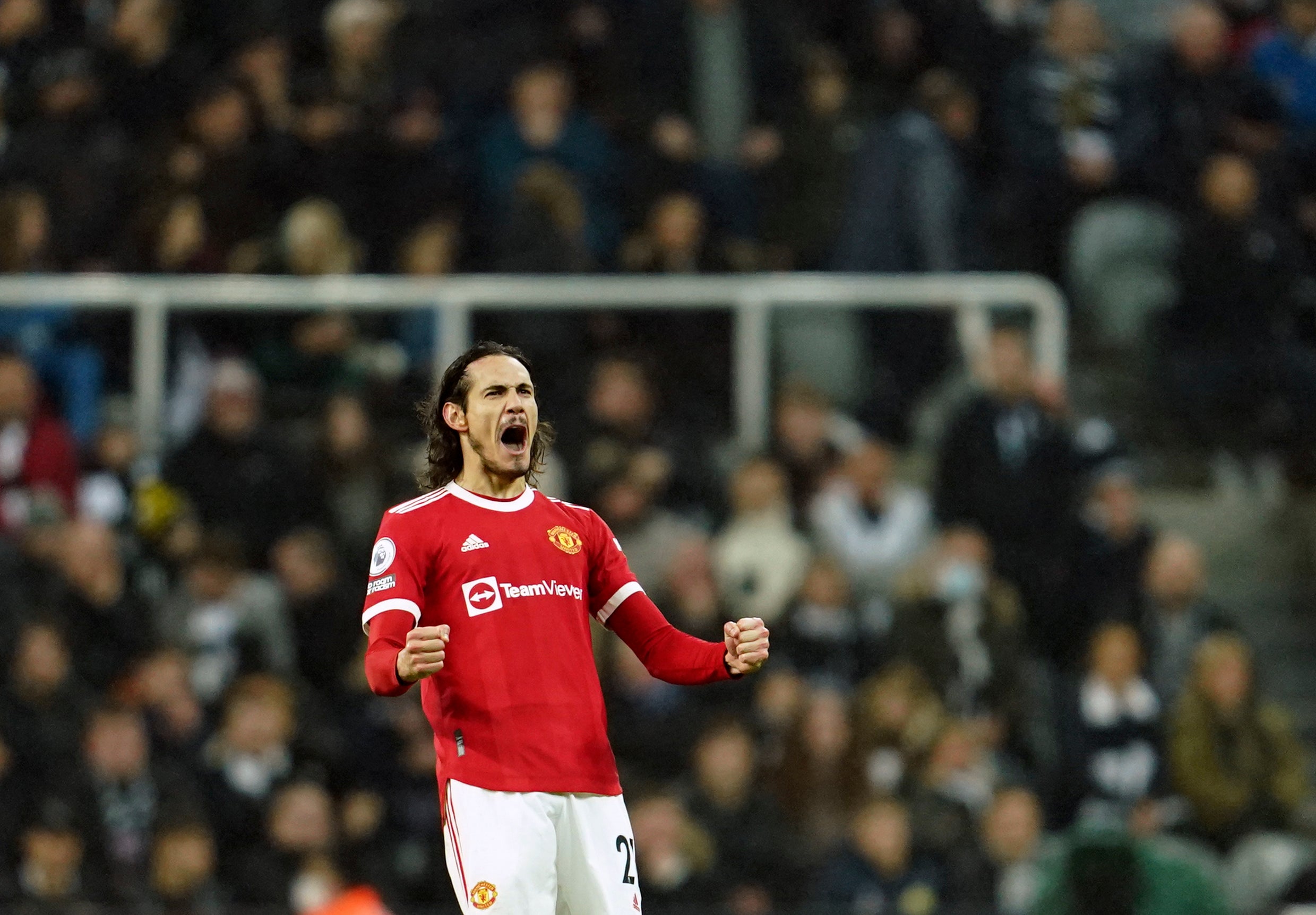 Edinson Cavani celebrates his equaliser against Newcastle