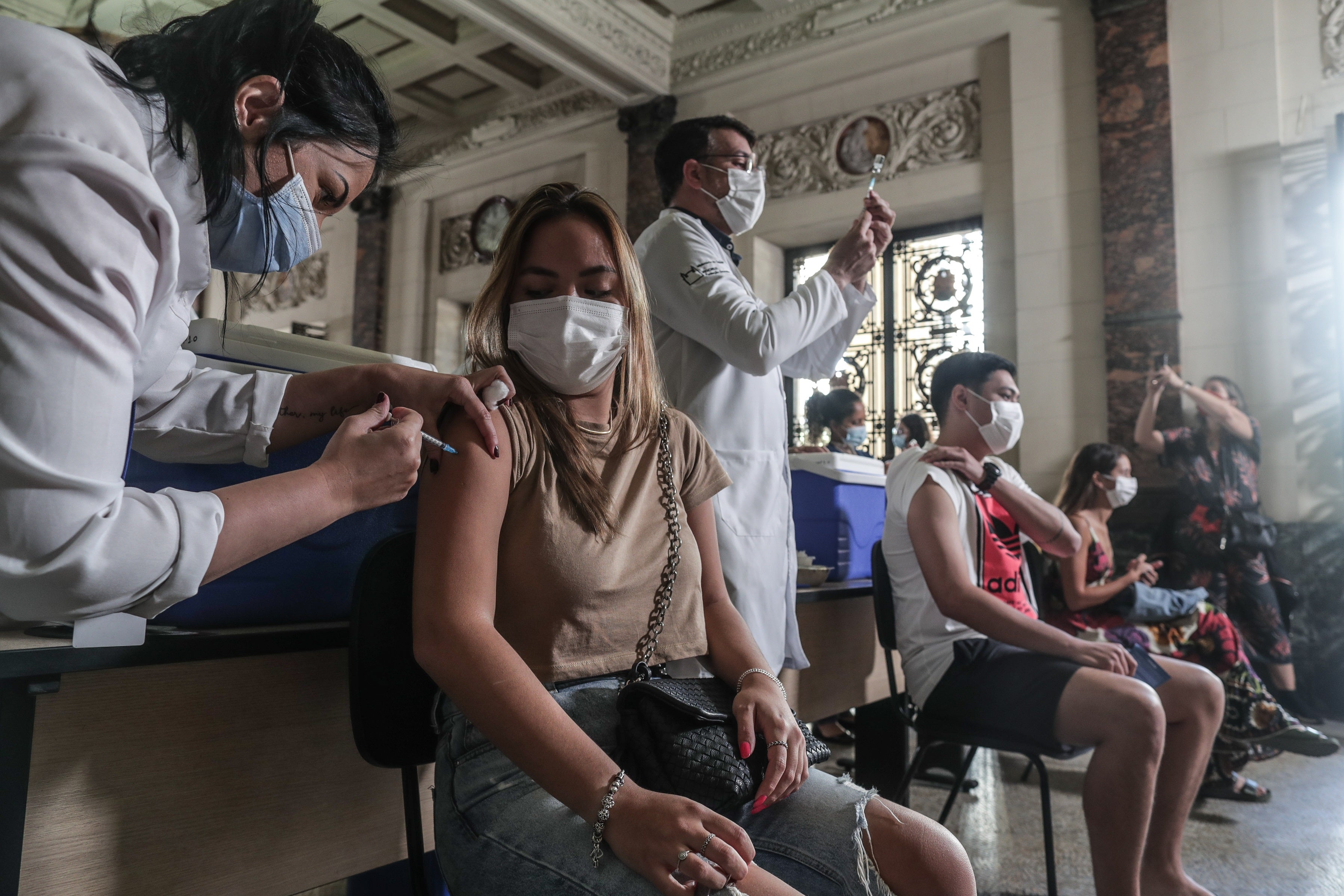 A person receives a Covid vaccine in Rio de Janeiro, Brazil