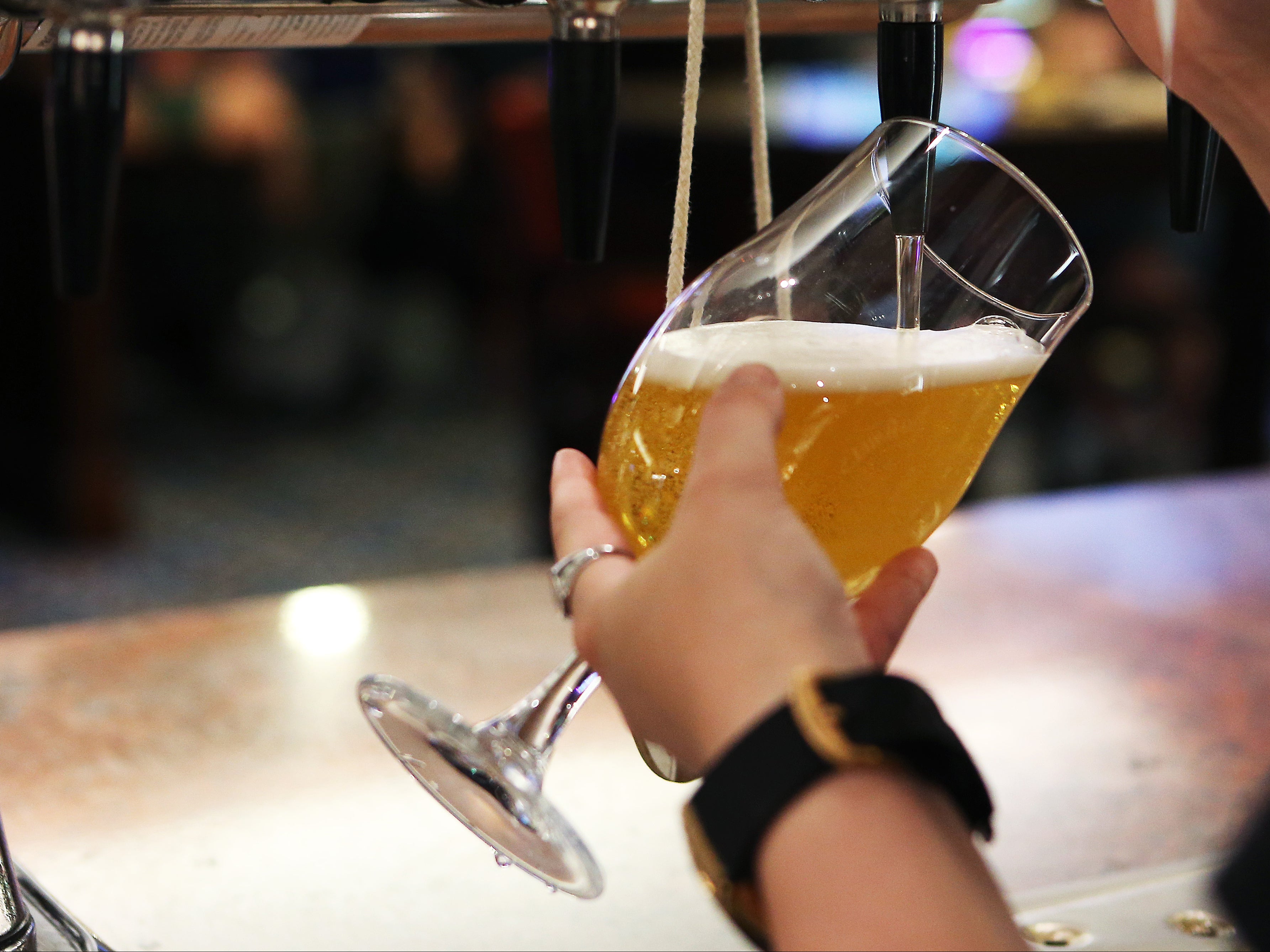 A bartender pours a pint on so-called ‘Freedom Day’ in England