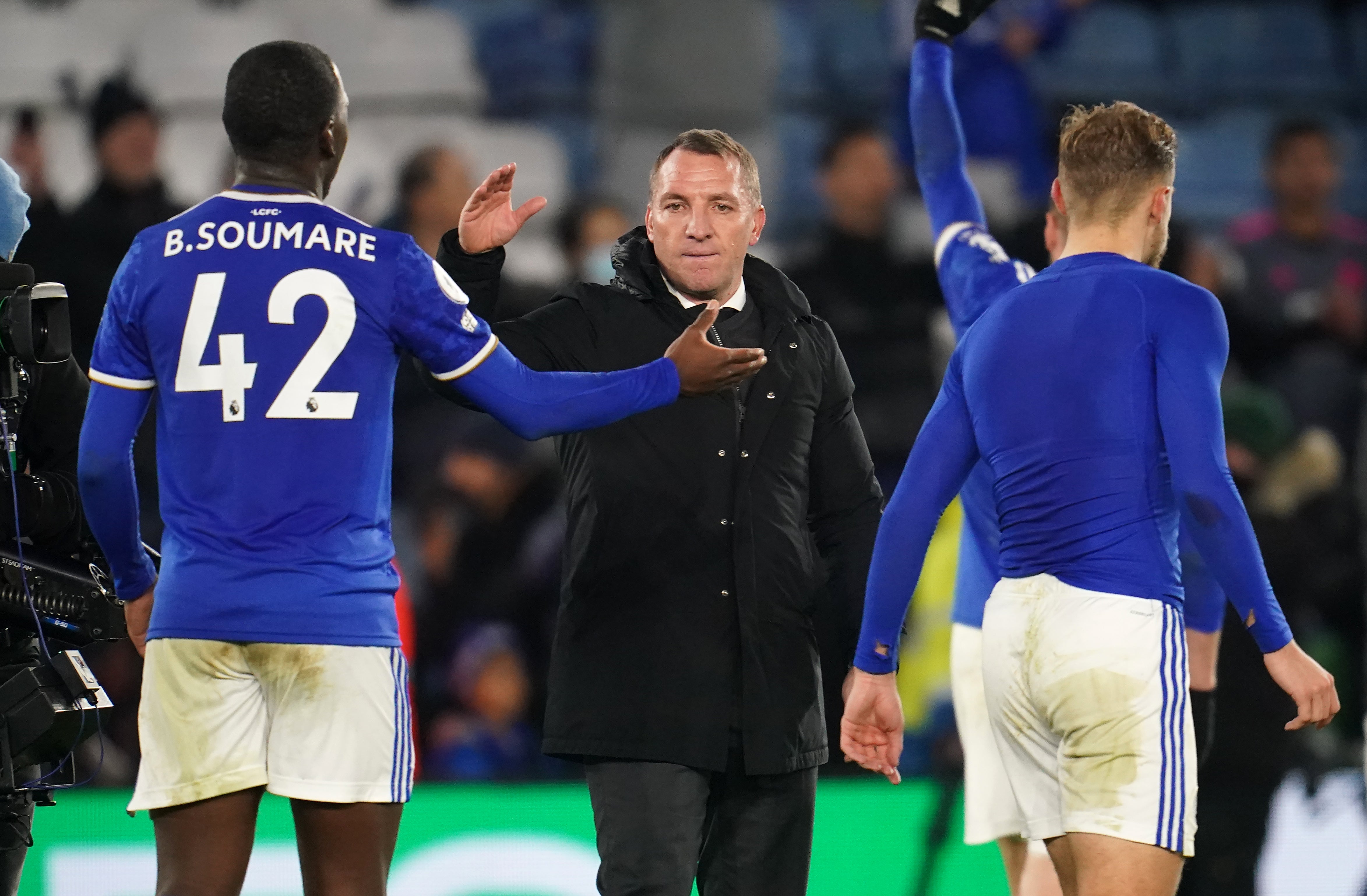 Brendan Rodgers, centre, congratulates his players after the game (Nick Potts/PA)