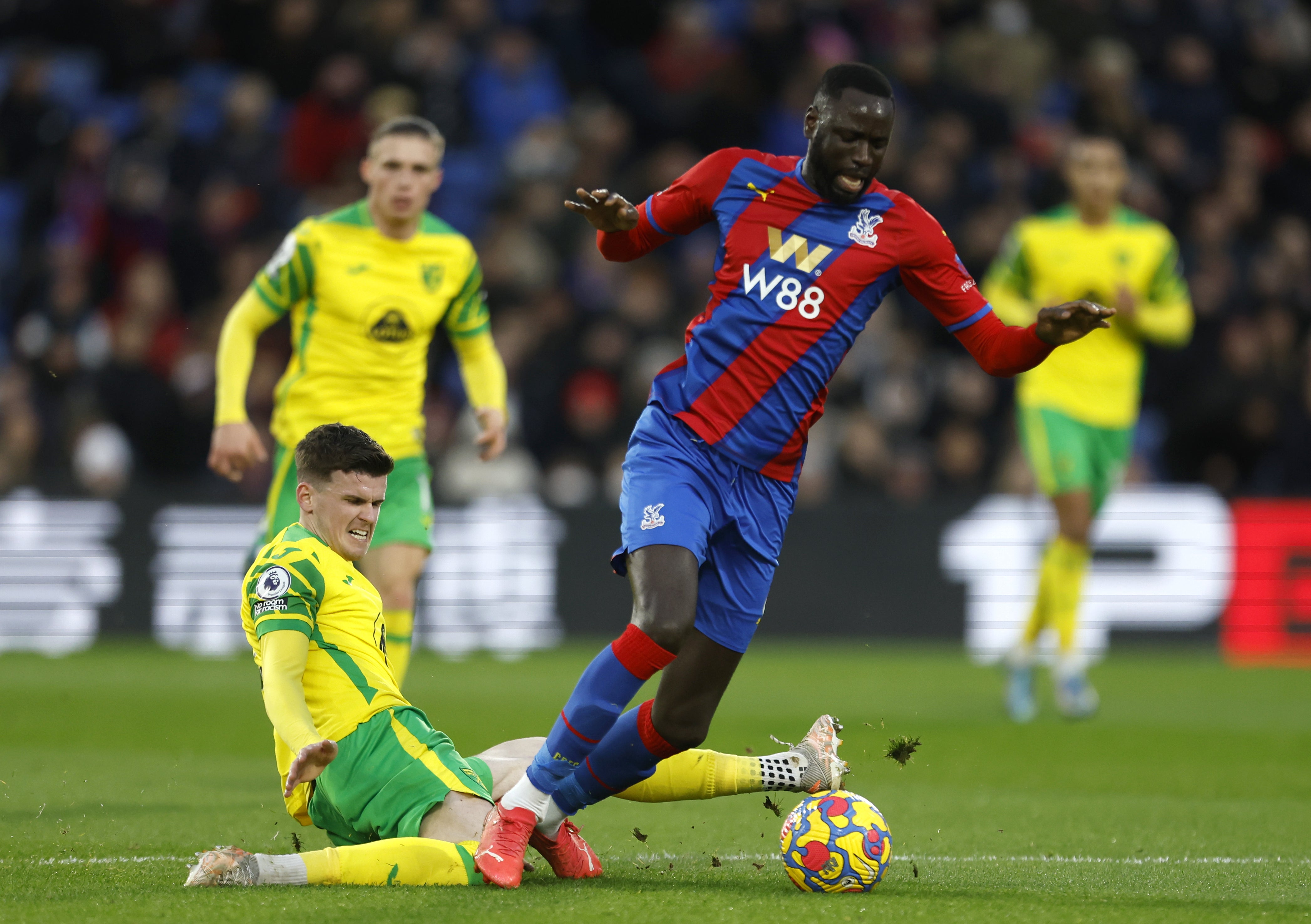 Norwich’s Sam Byram slides in against Crystal Palace midfielder Cheikhou Kouyate (Steven Paston/PA)