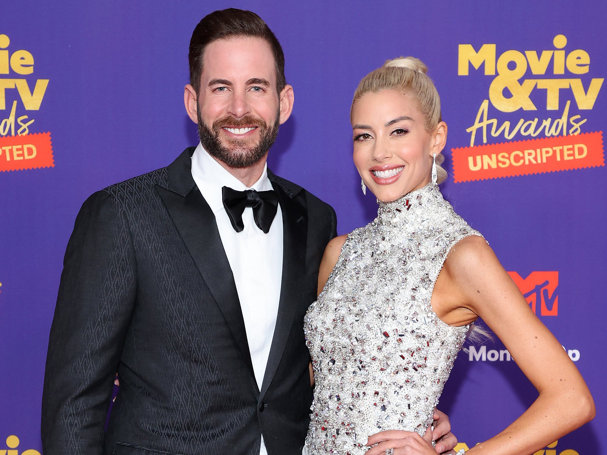 Tarek El Moussa and Heather Rae Young attend the 2021 MTV Movie & TV Awards: UNSCRIPTED in Los Angeles, California