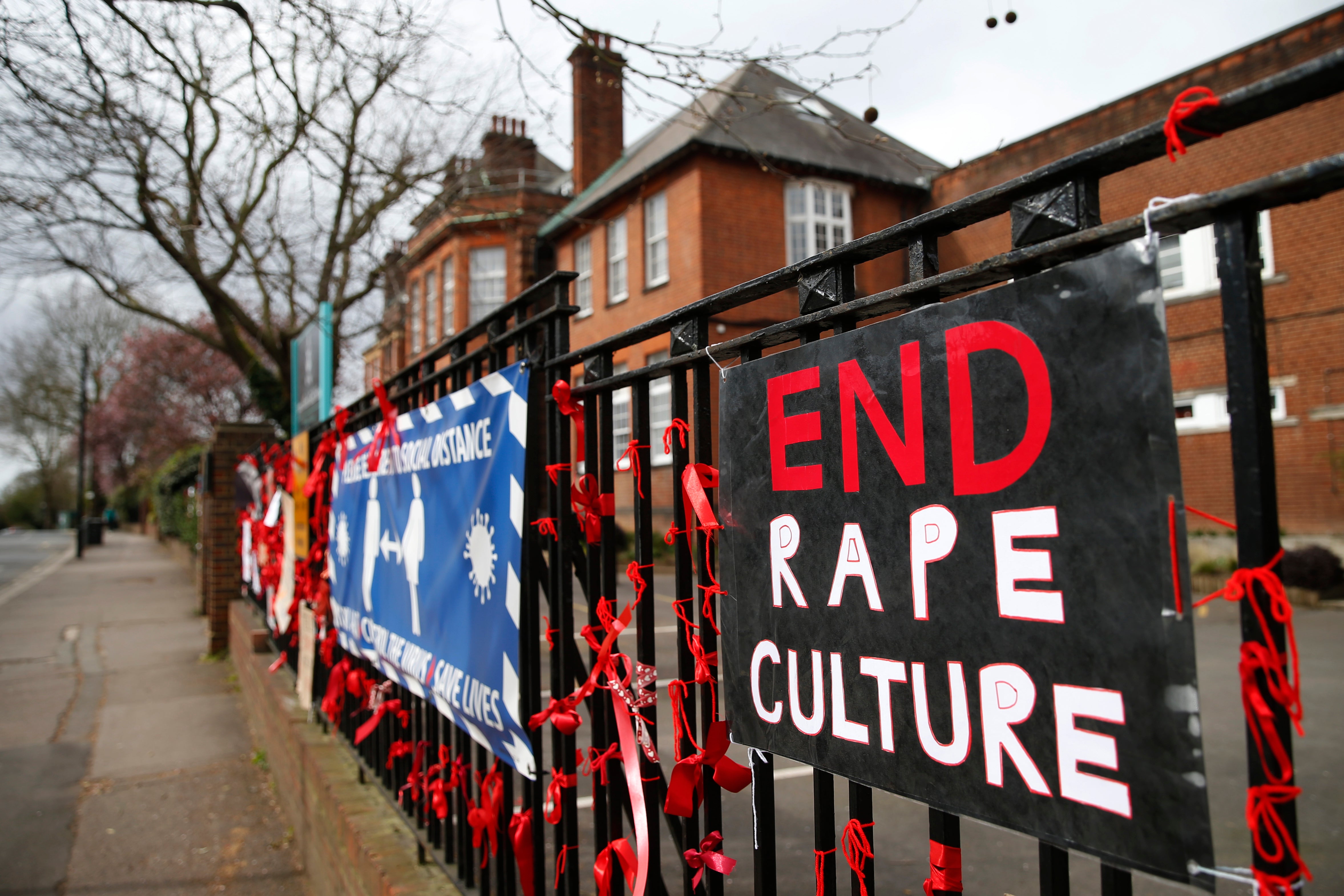 Pupils at James Allen’s Girls’ School (JAGS) in London pinned placards and red ribbons to the fence in protest against ‘rape culture’ and a nearby boys school which they have called a ‘breeding ground for sexual predators’, in March 2021