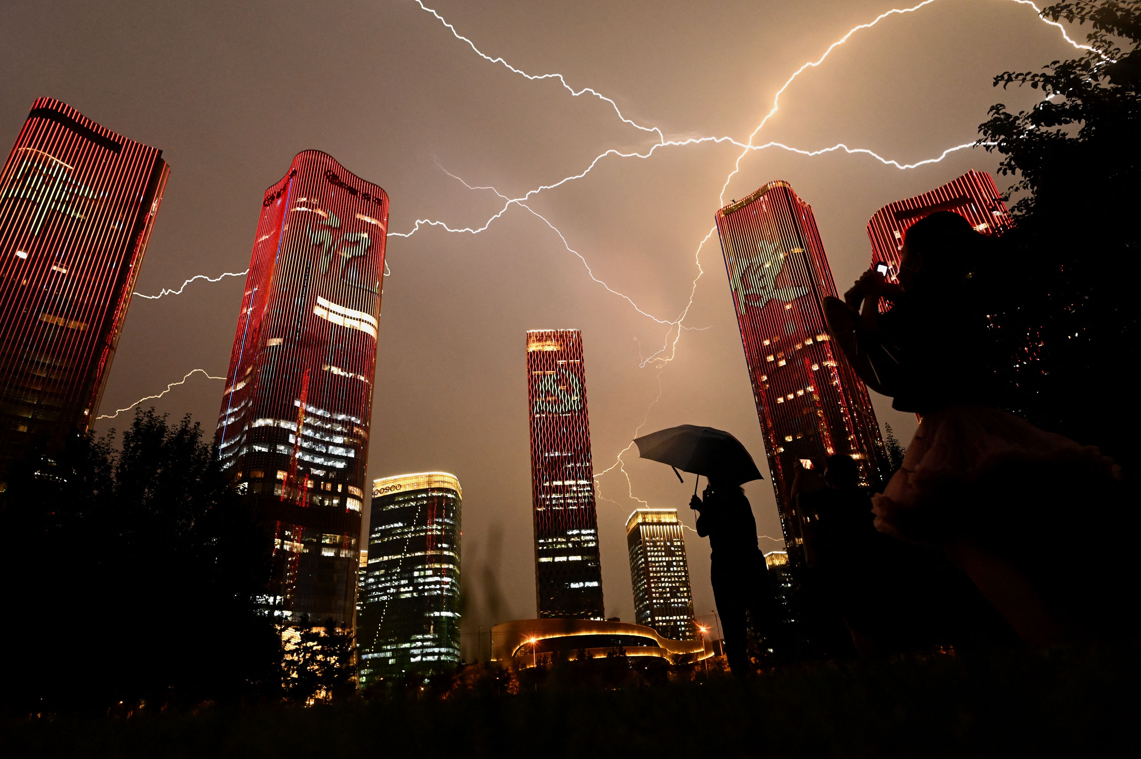 A bolt of lightning crosses the sky on the eve of the 100th anniversary of the Chinese Communist Party in Beijing