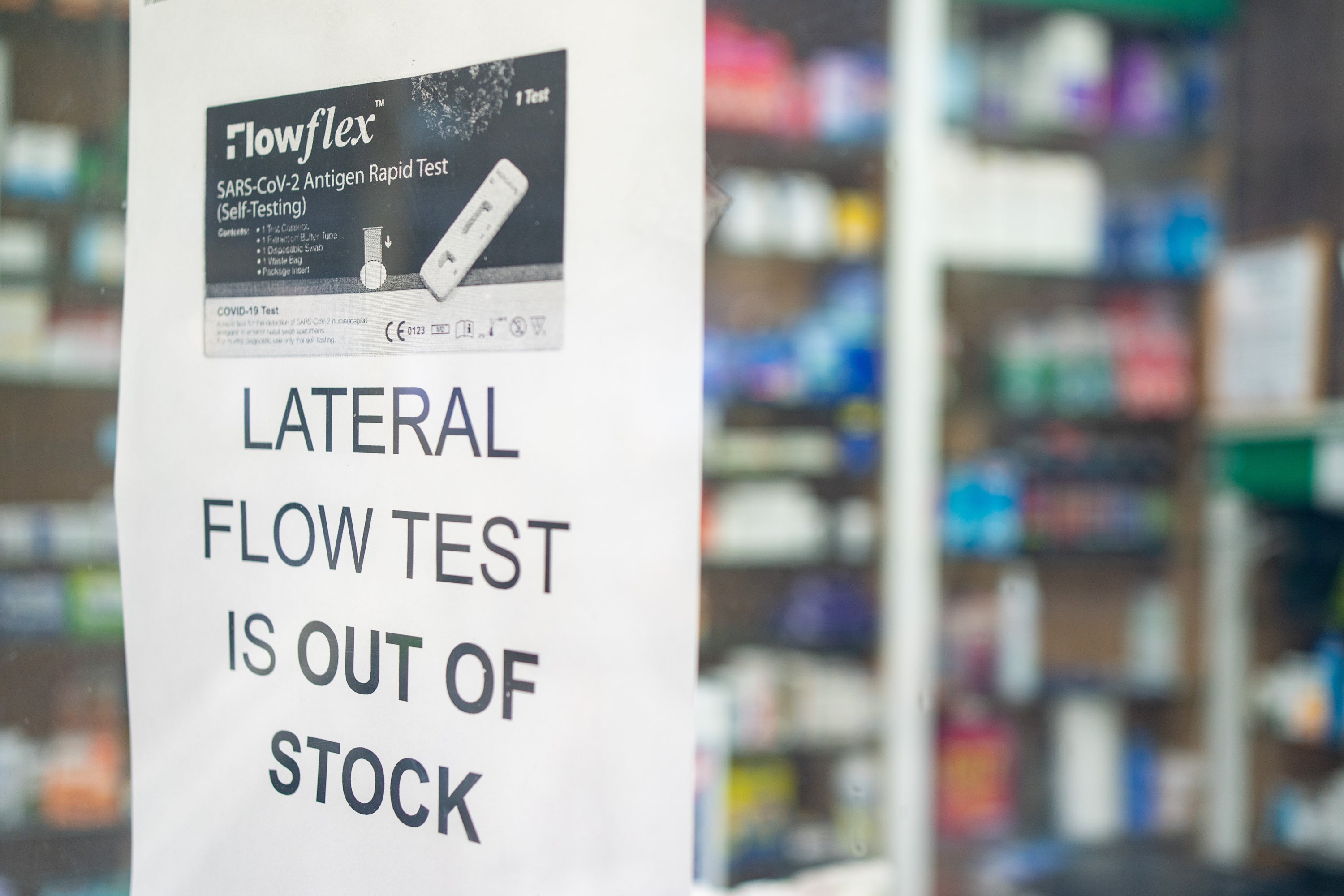 A sign saying lateral flow coronavirus tests are out of stock is seen at a pharmacists in London (Dominic Lipinski/PA)