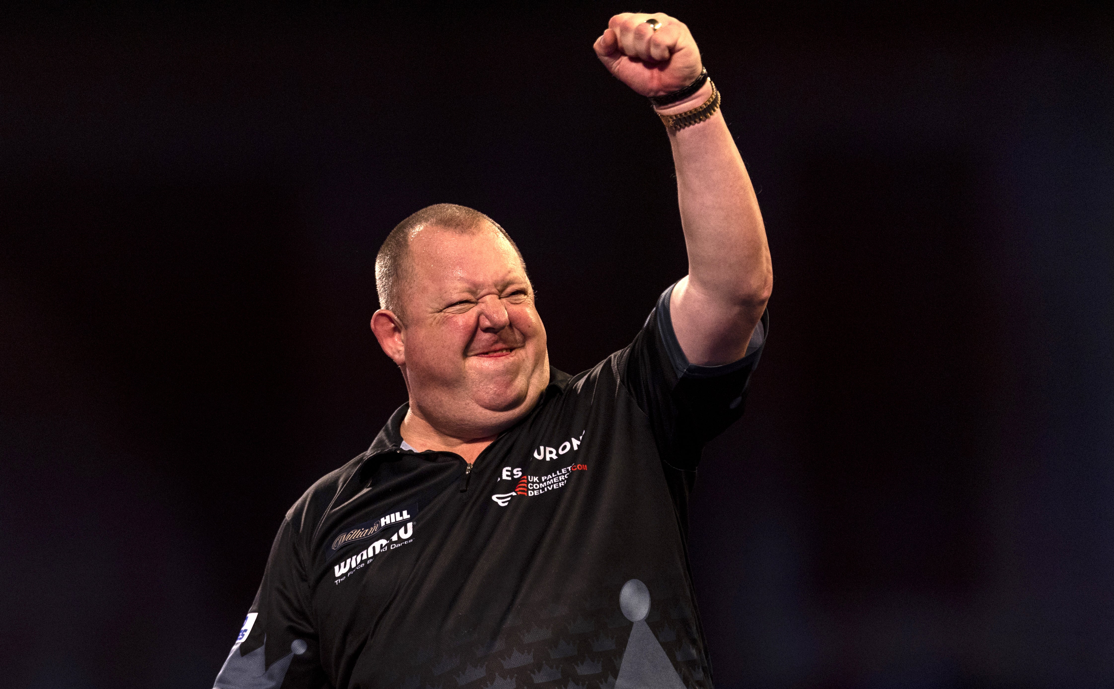 Mervyn King celebrates reaching the quarter-finals of the William Hill World Darts Championship for the first time since 2009 (Steven Paston/PA)