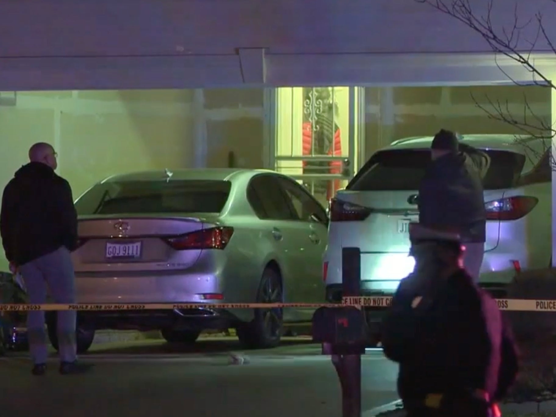 Police investigate the garage where the shooting took place