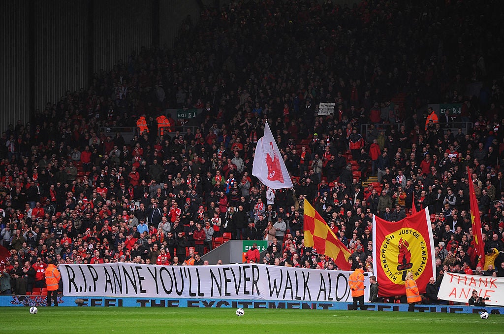 Liverpool fans display a banner in memory of Anne Williams after her death in April 2013