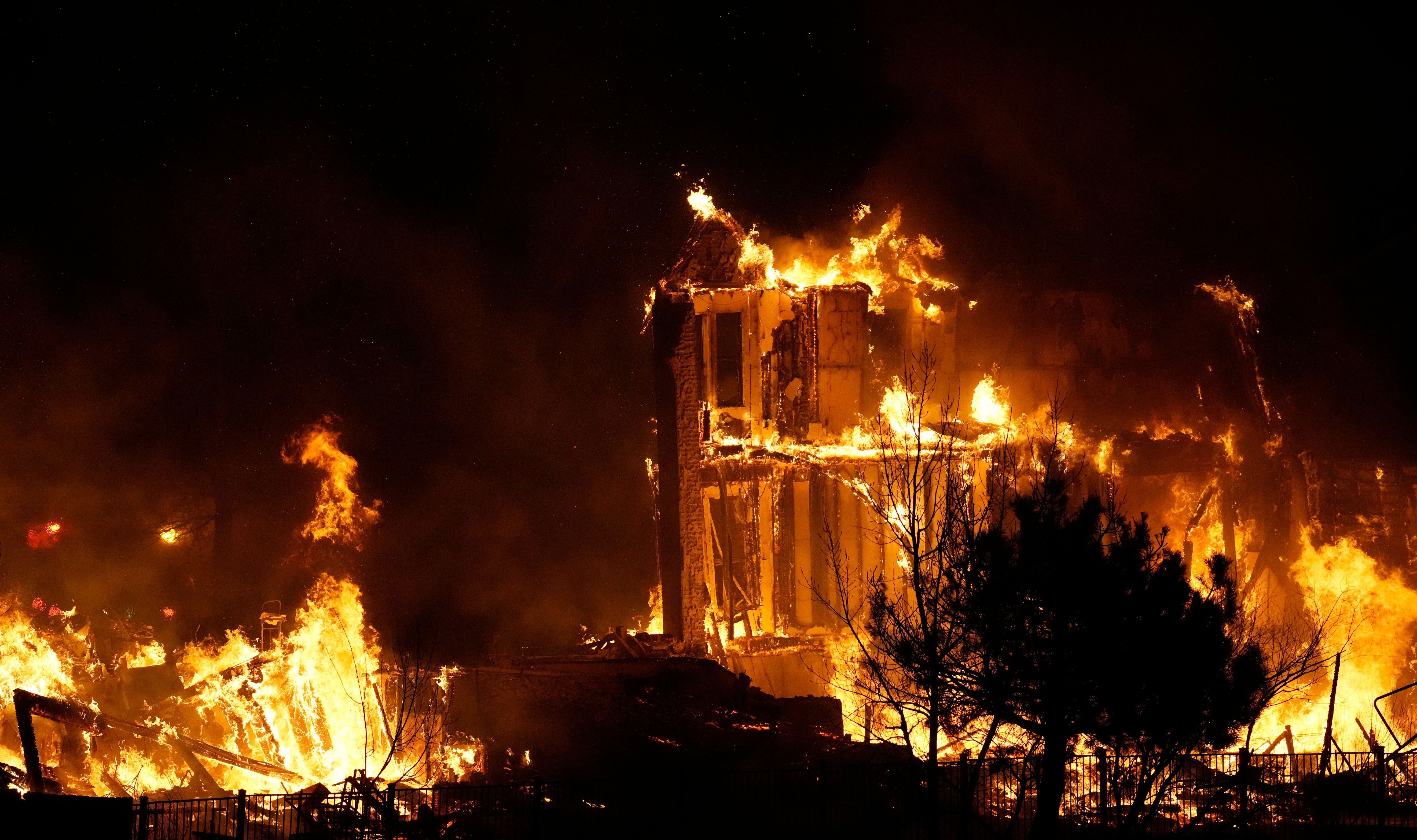 Homes burn as a wildfire rips through a development near Broomfield, Colorado