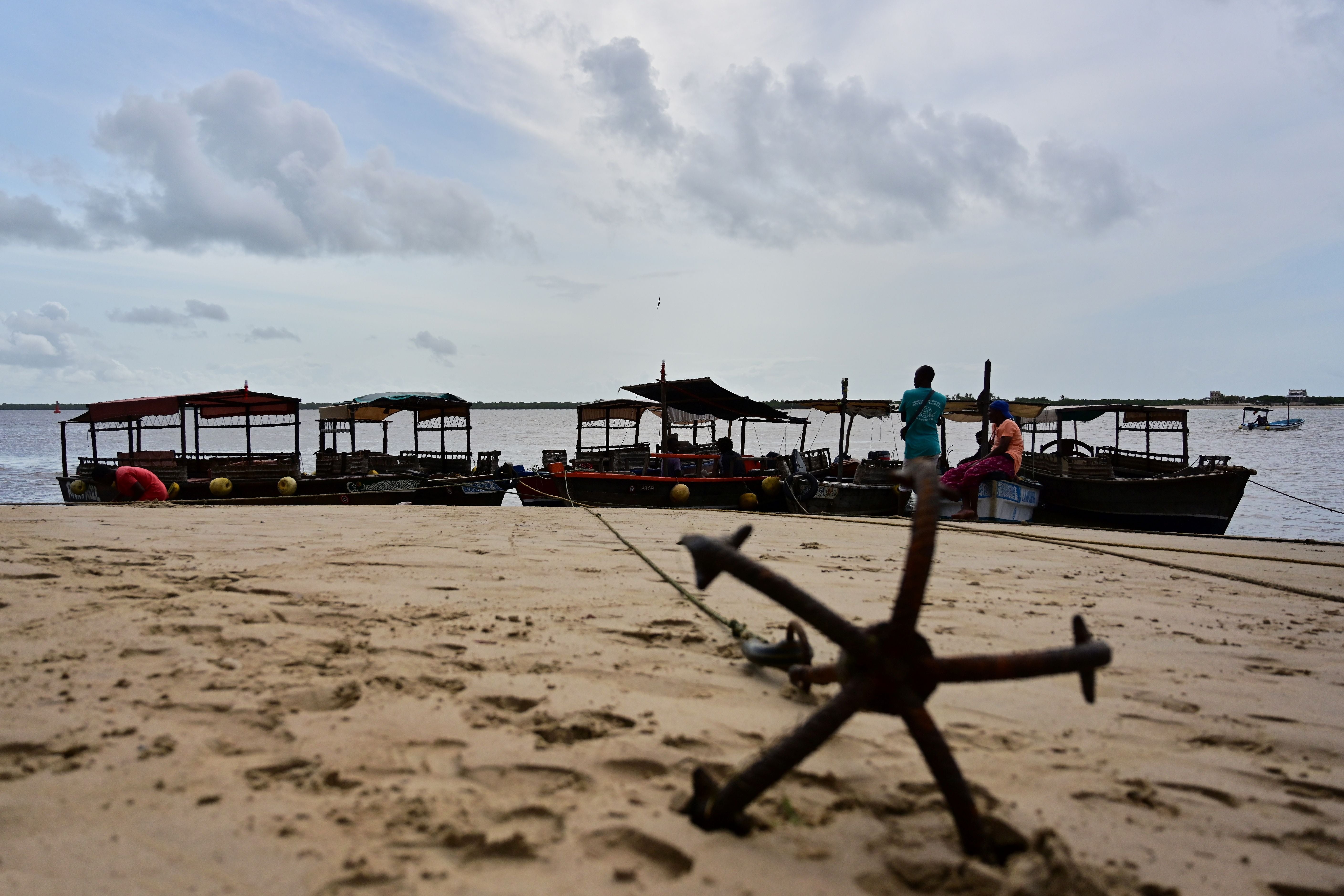 Fishing boats waits on the beach for the tide to subside at Kenya’s resort town of Lamu