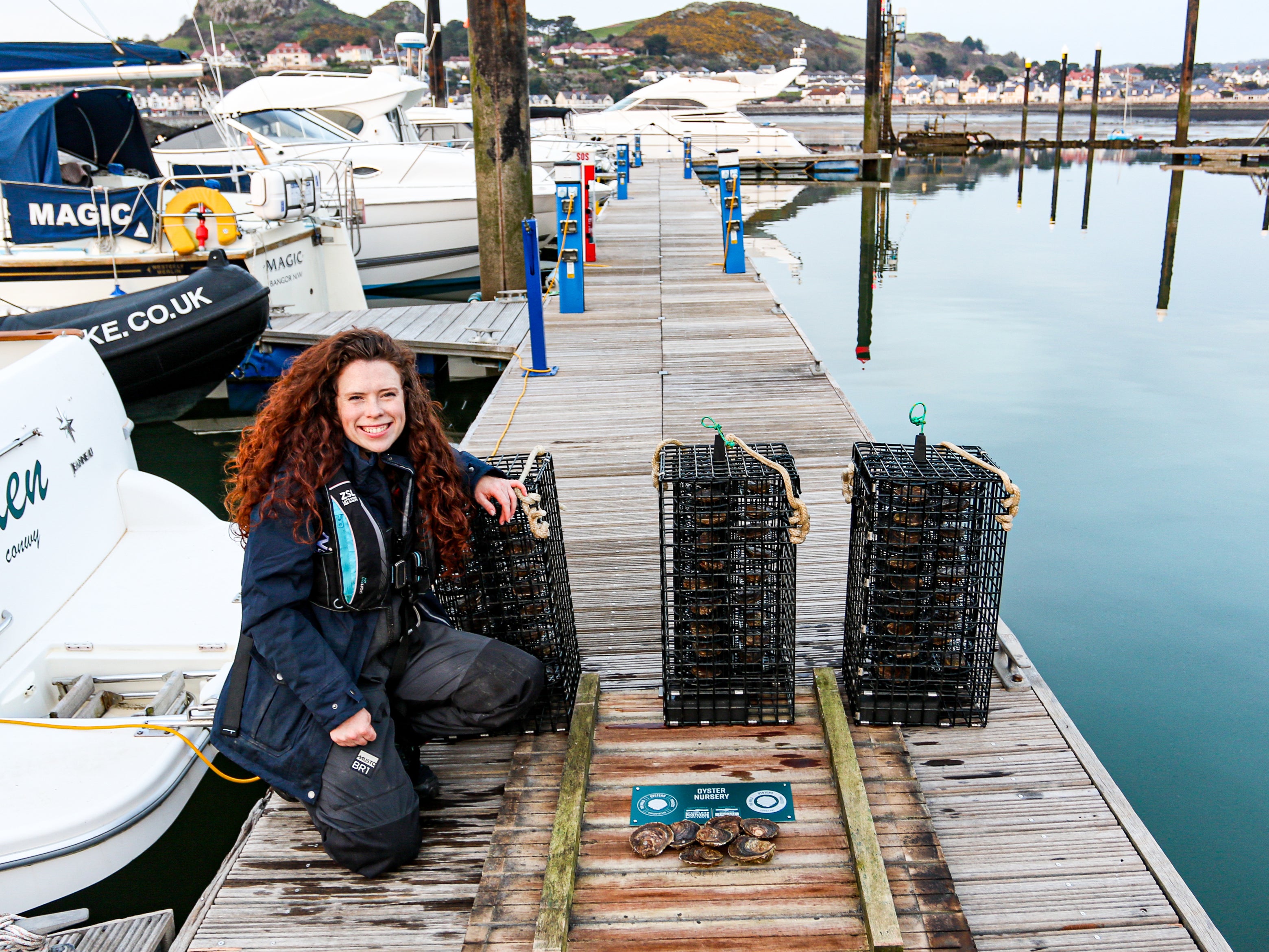 Celine Gamble, manager of the Wild Oysters Project, at Conwy Bay in Wales