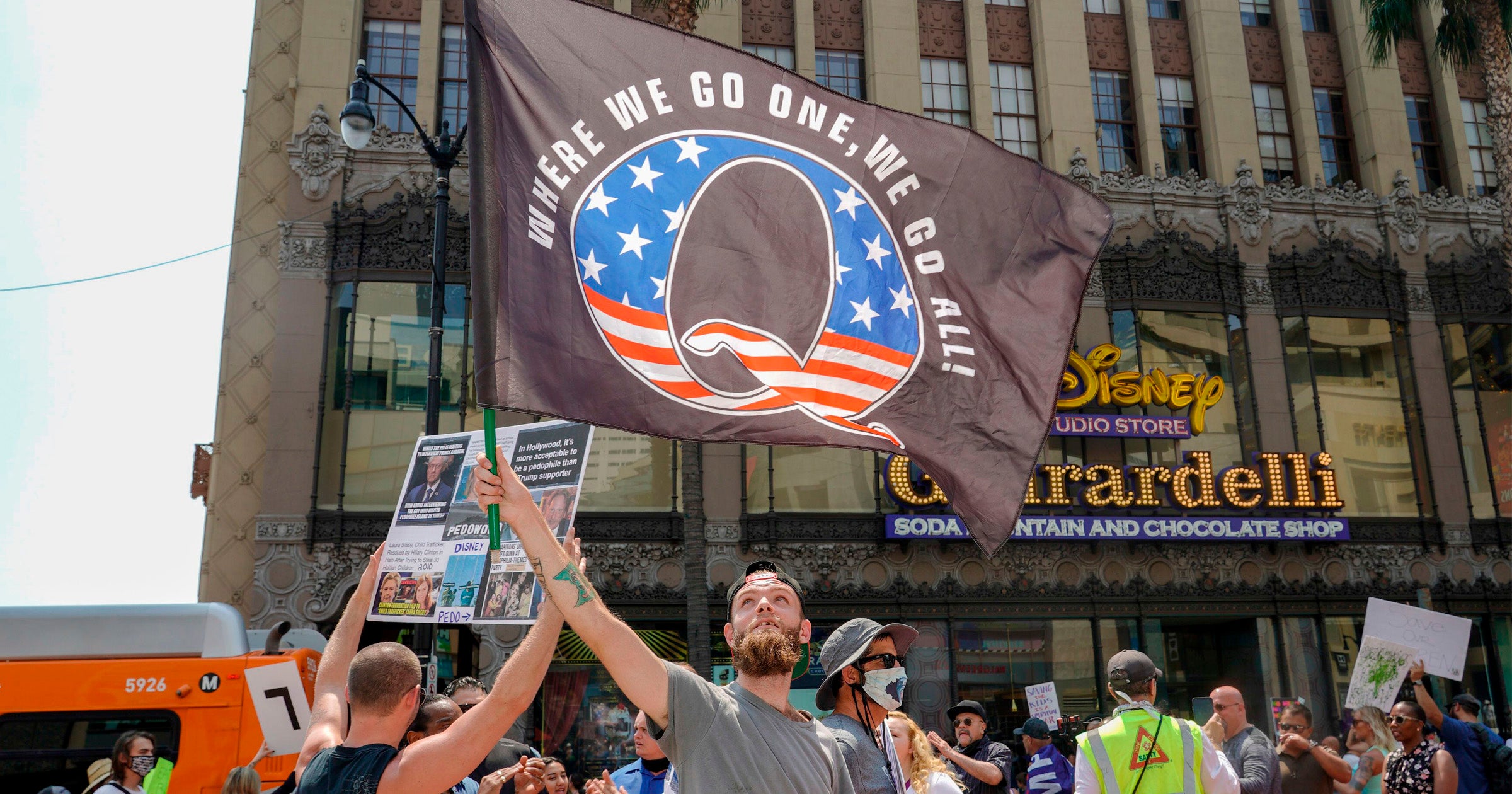 QAnon demonstrators protest child trafficking, on Hollywood Boulevard in Los Angeles