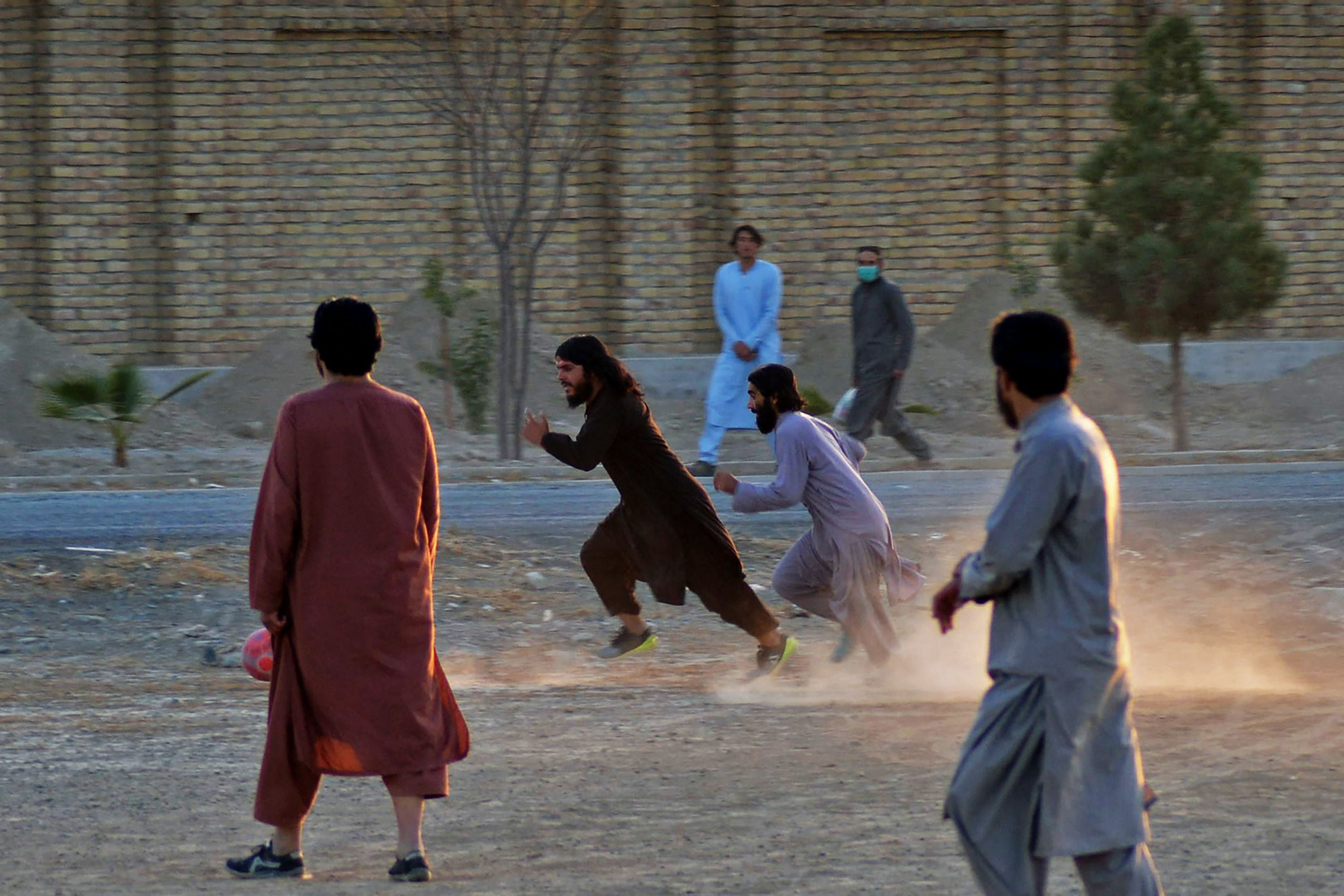 Taliban members play football in Kandahar