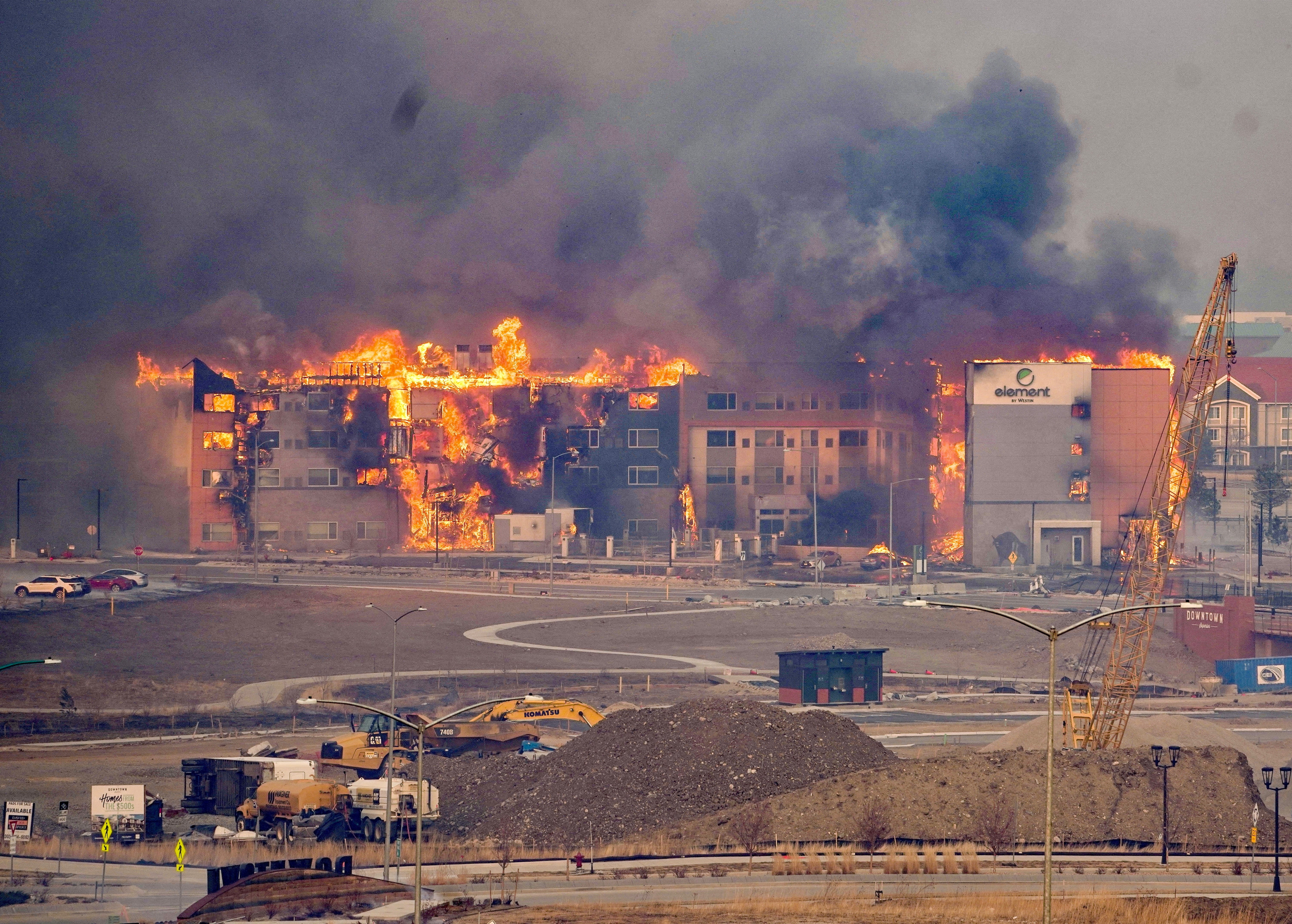 Structures burn, including an Element Hotel, as a wind-driven wildfire forced evacuation of the Superior suburb of Boulder.