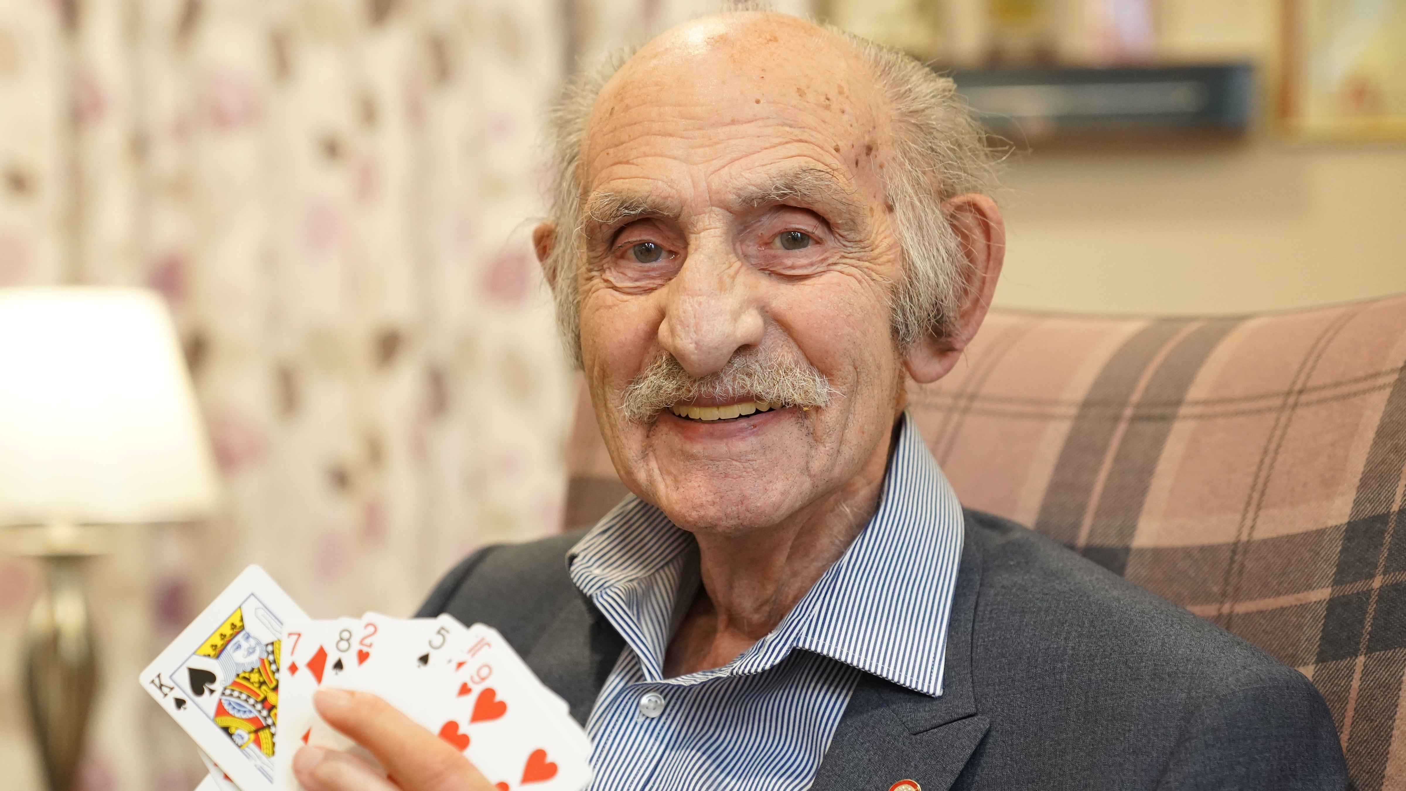 Henry Lewis, honorary vice president of The Magic Circle, at his home in north London, after he was awarded an MBE for services to fundraising and charitable causes in the New Year honours list (Kirsty O’Connor/PA)