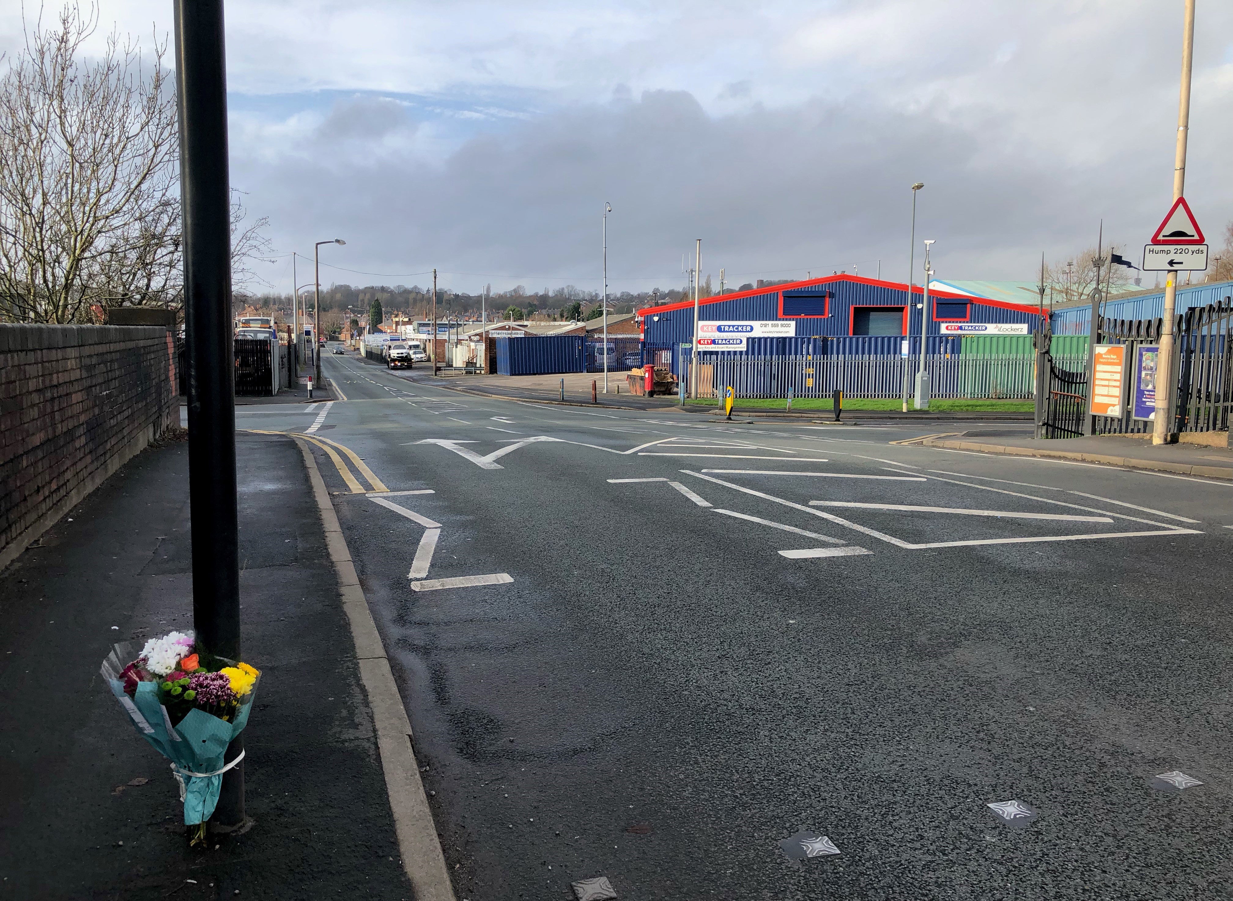 Flowers attached to traffic lights at a pedestrian crossing near Rowley Regis station in the West Midlands, after the death of a 14-year-old girl who was hit by a car on New Year’s Eve (Matthew Cooper/PA)