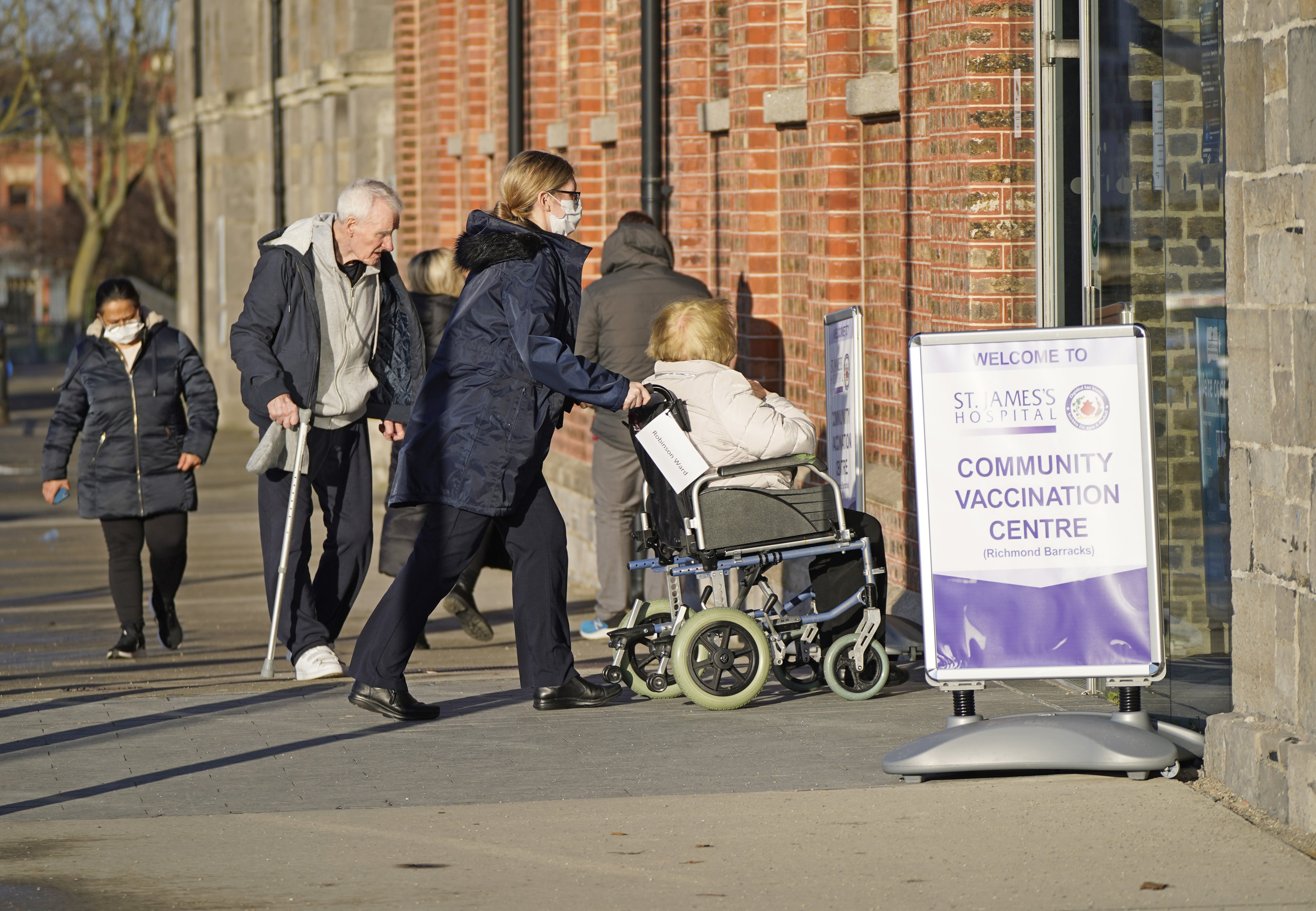 People arrive at a Covid vaccination centre in Inchicore, Dublin (Niall Carson/PA)