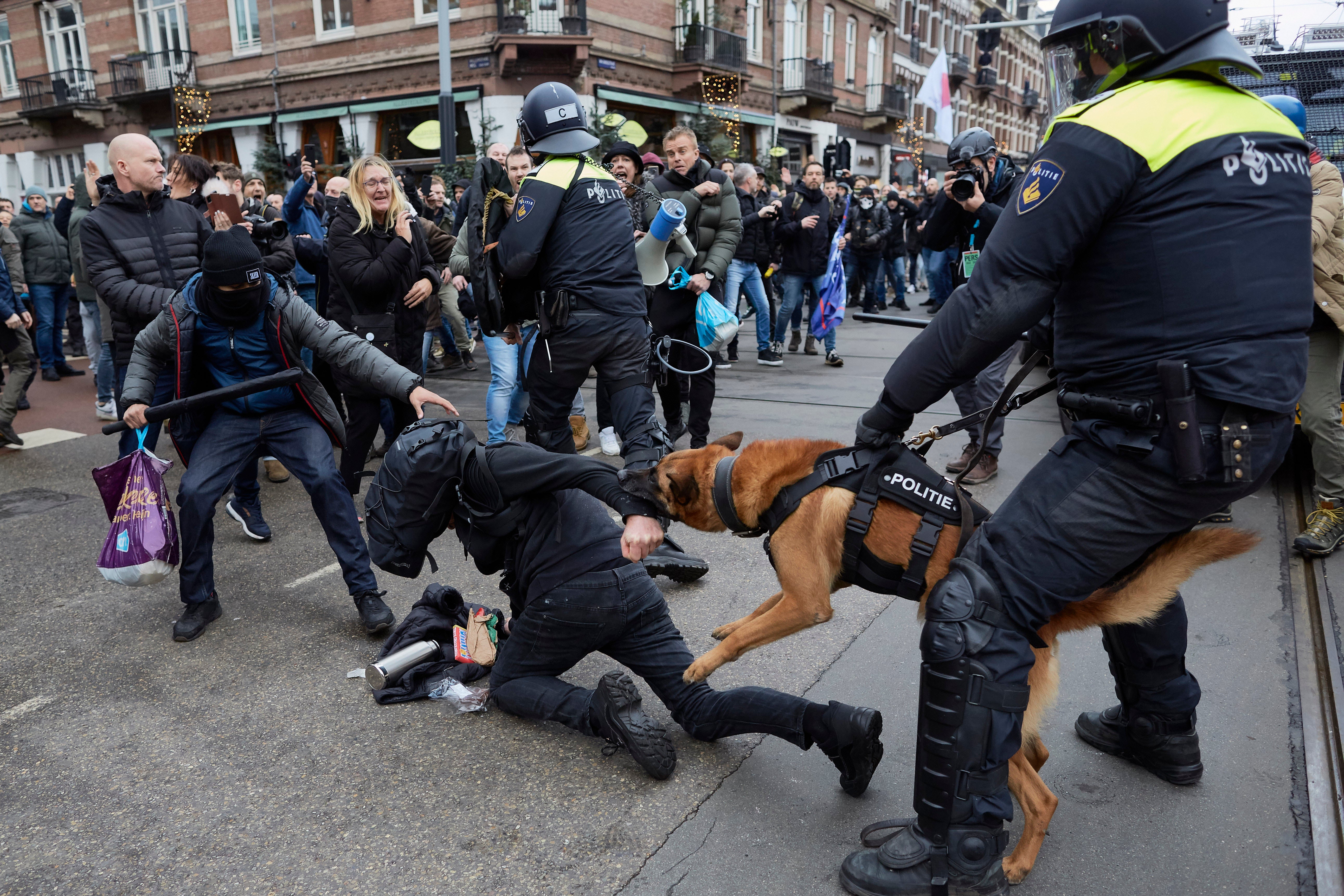 Clashes erupt in Amsterdam between police officers and anti-vaxxers affiliated to far-right parties