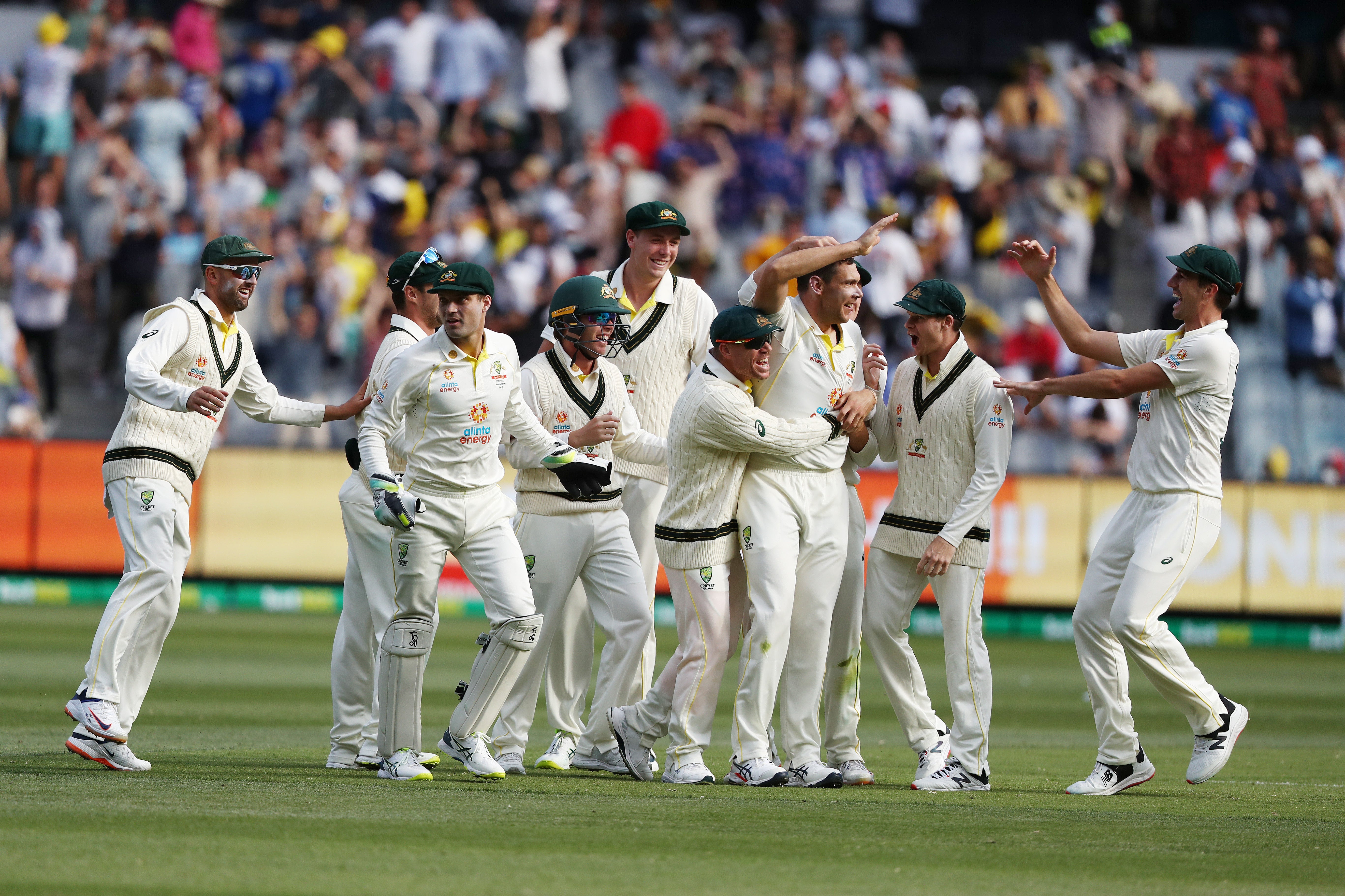 Australia celebrate on day two of the third Test in Melbourne (Jason O’Brien/PA).