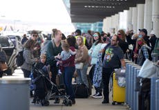 More than 2,400 US flights are canceled as Omicron and adverse weather continues to cause travel chaos