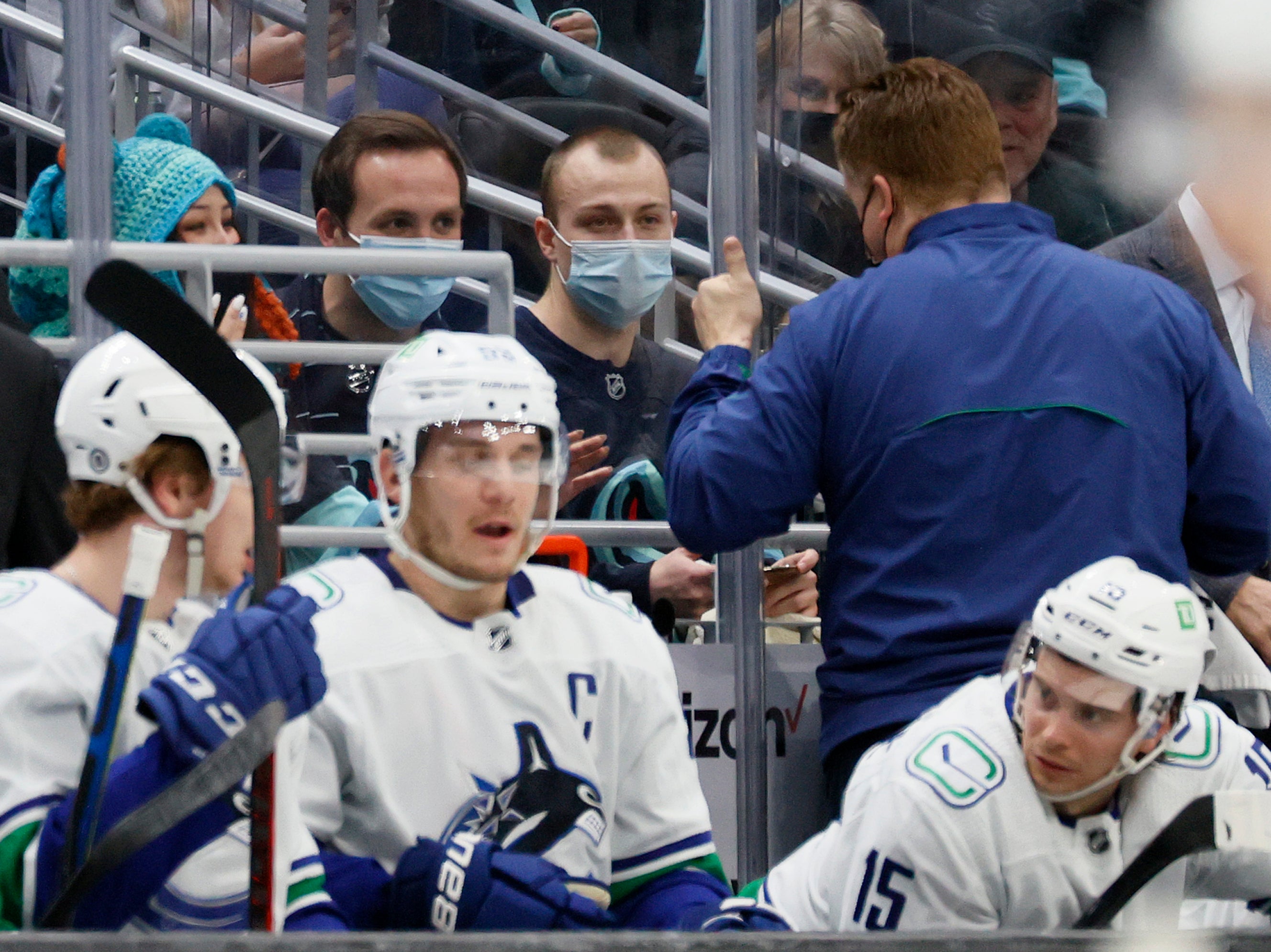 Seattle Kraken fan Nadia Popovici and Vancouver Canucks equipment manager Brian Hamilton greet one another during the first period at Climate Pledge Arena on 1 January 2022 in Seattle, Washington. Popovici made headlines by alerting Hamilton at a previous game between the teams on 23 October of a cancerous mole