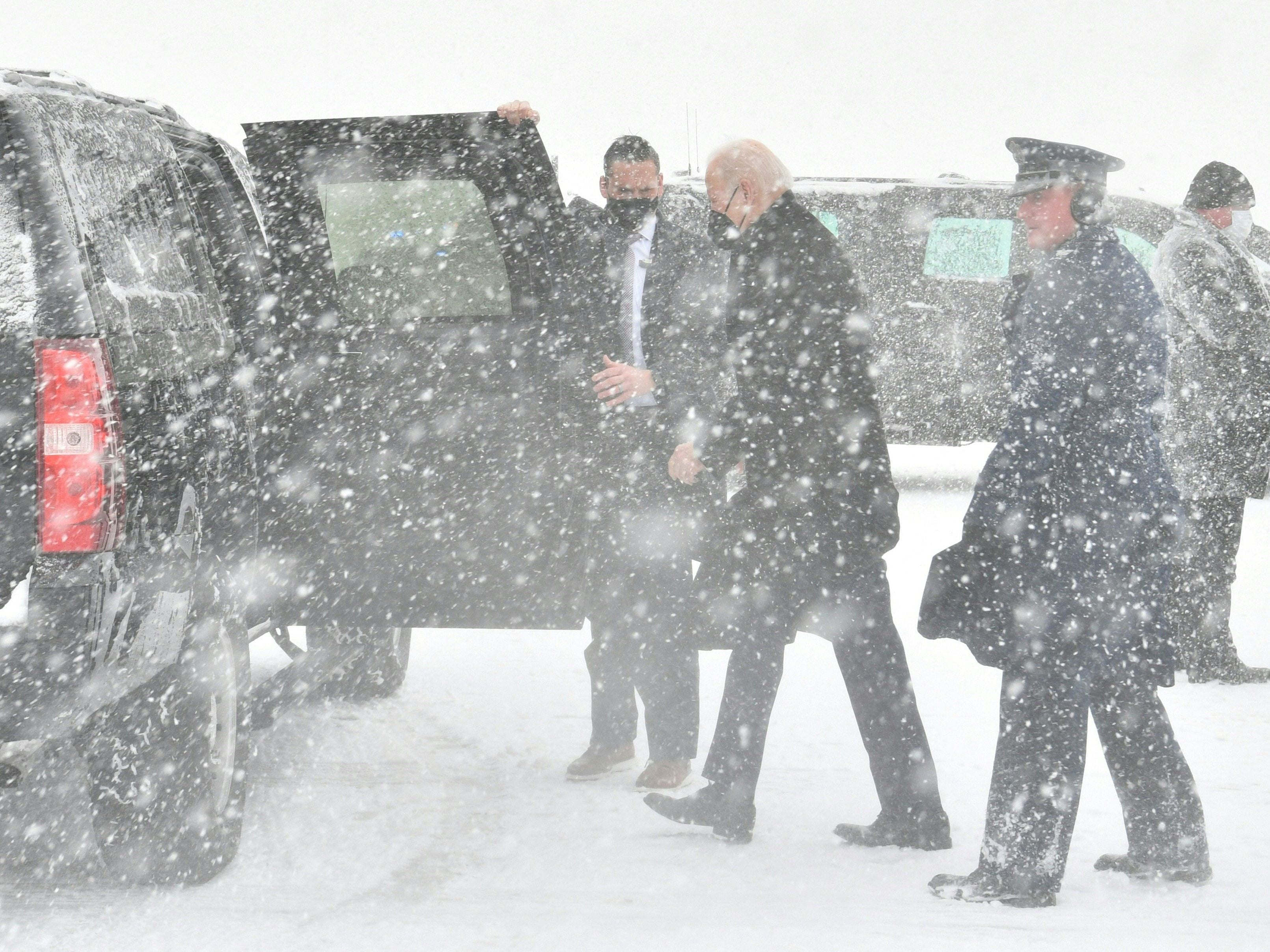 Joe Biden arrives at Andrews Air Force Base during a snow storm on January 3, 2022, in Maryland