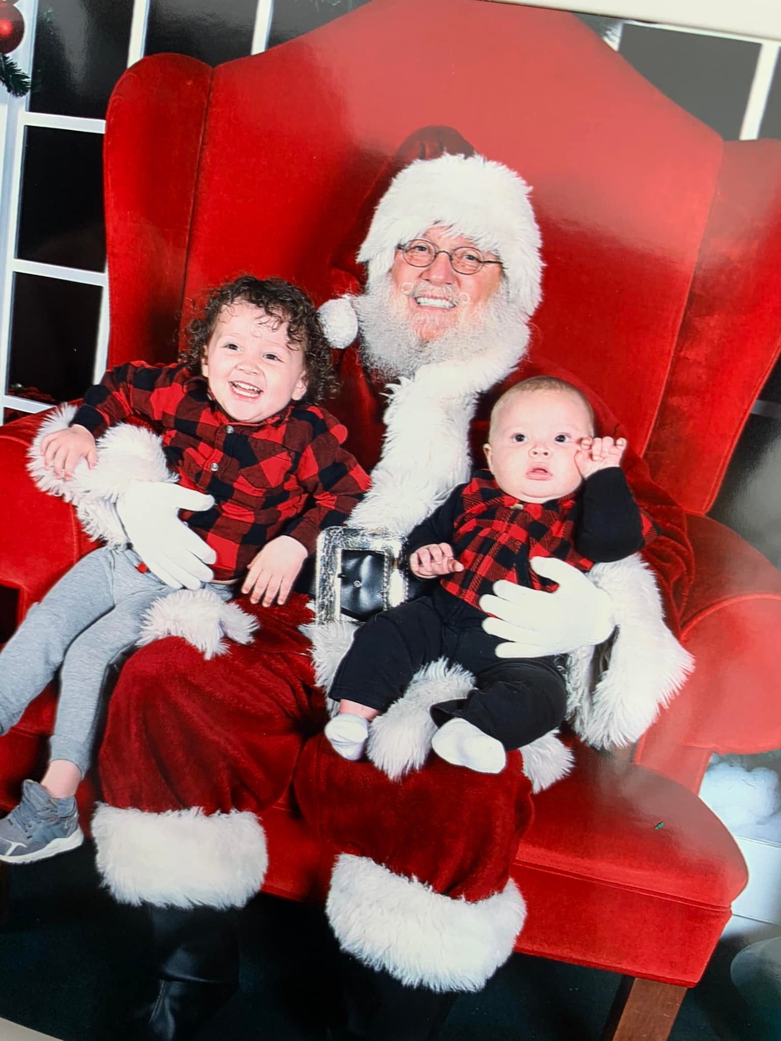 Adrian James and his little brother, Caius, meets Santa Claus shortly before Christmas 2021