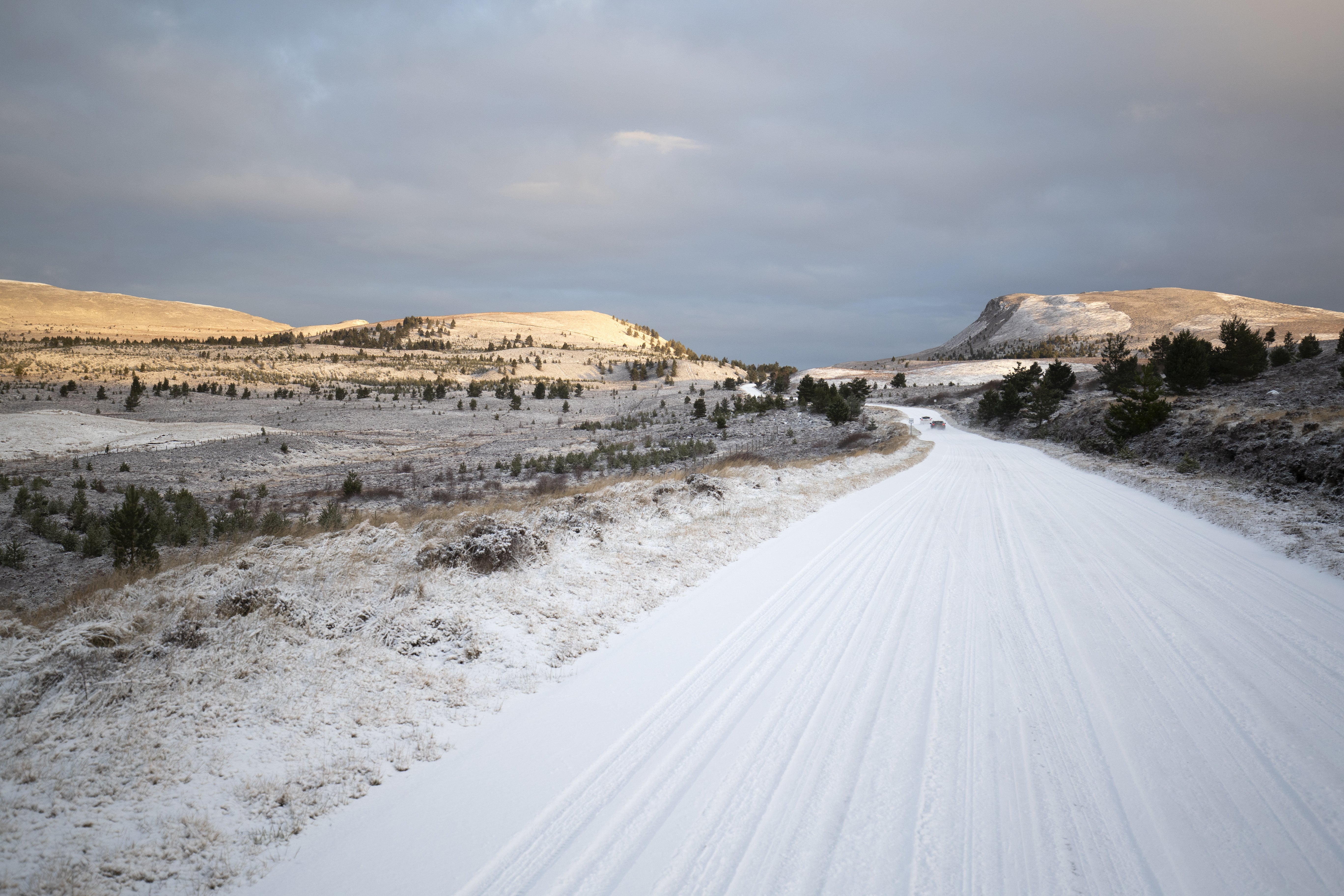 Snow covers the B9007 between Carrbridge and Forres in the Cairngorms National Park (Jane Barlow/PA)