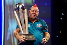 Peter Wright holds nerve to win second world title