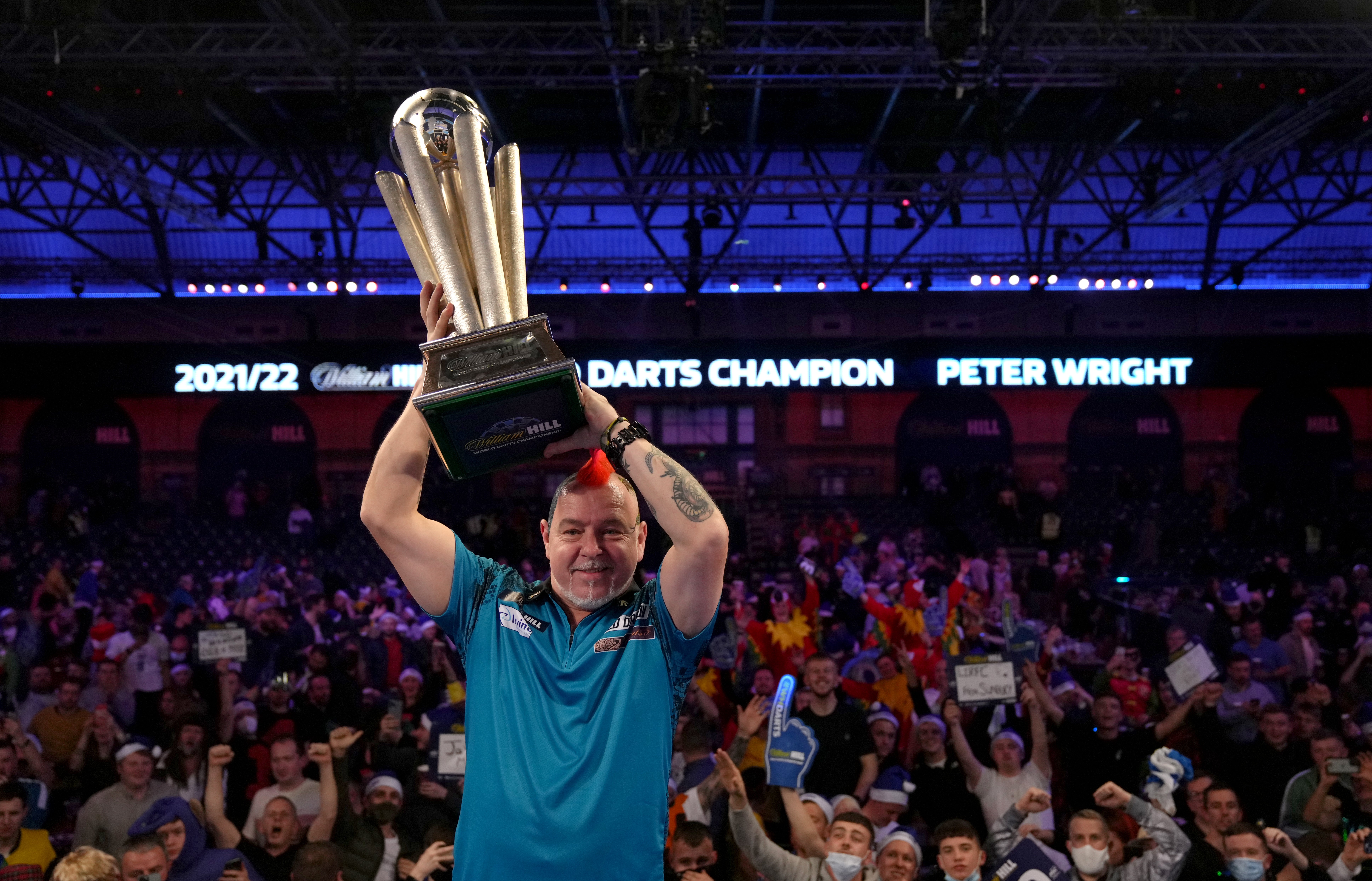 Peter Wright celebrates winning his second world title (John Walton/PA).